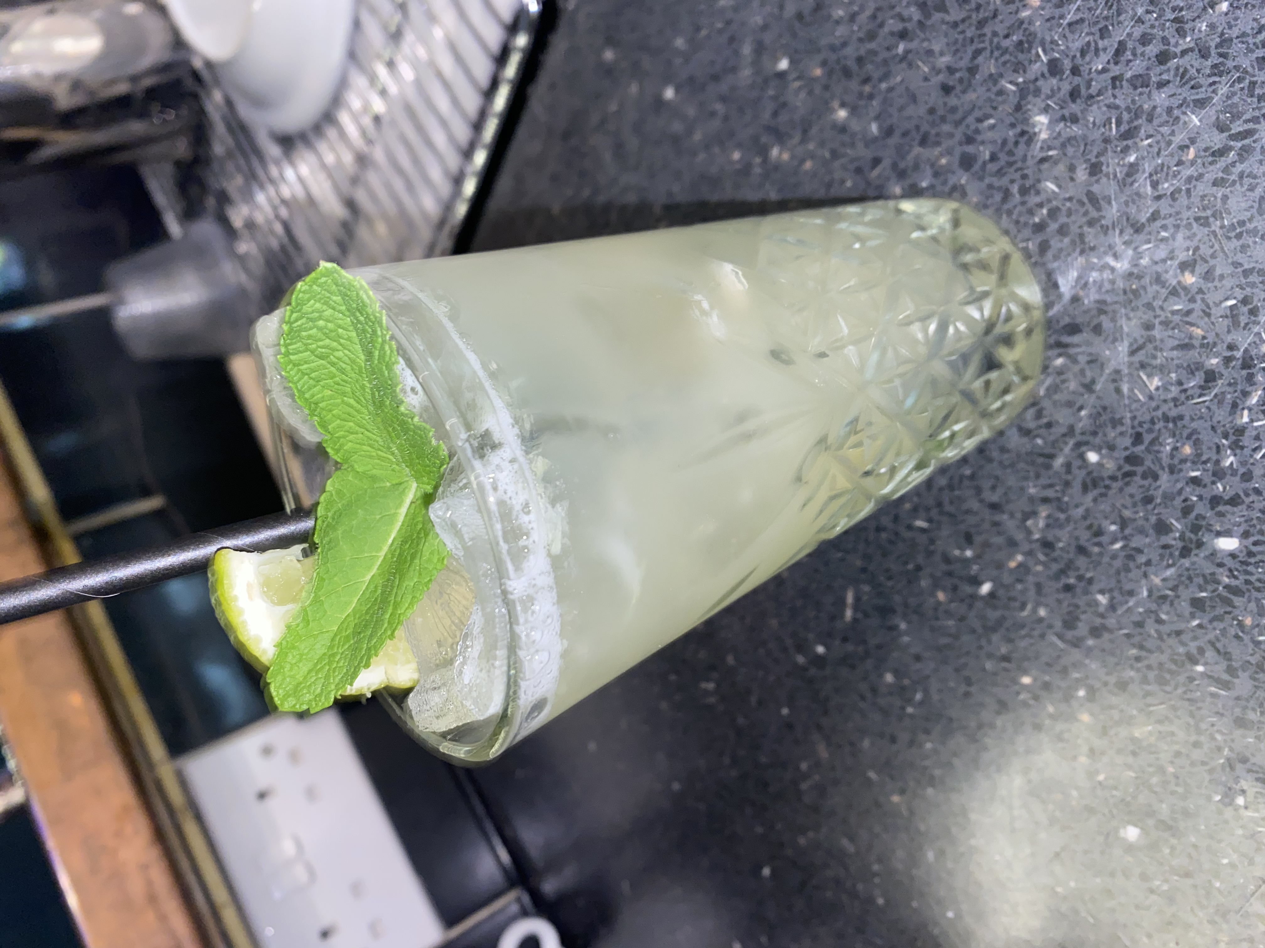 Refreshing cocktail with mint and lime at Alfie’s lounge summer event.