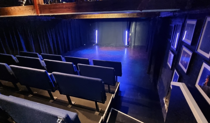 Versatile event space with tiered seating at Pleasance Theatre for presentations and performances.
