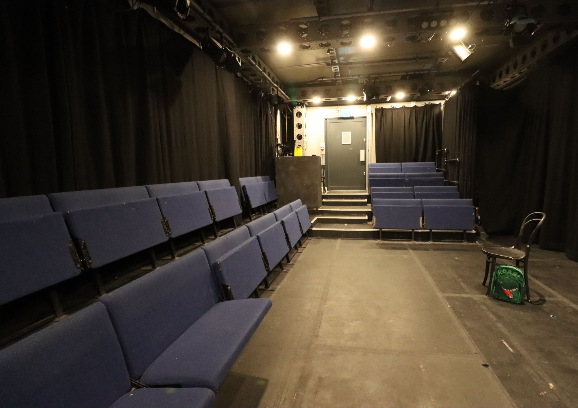 Intimate event space with tiered seating at Pleasance Theatre for workshops and performances.