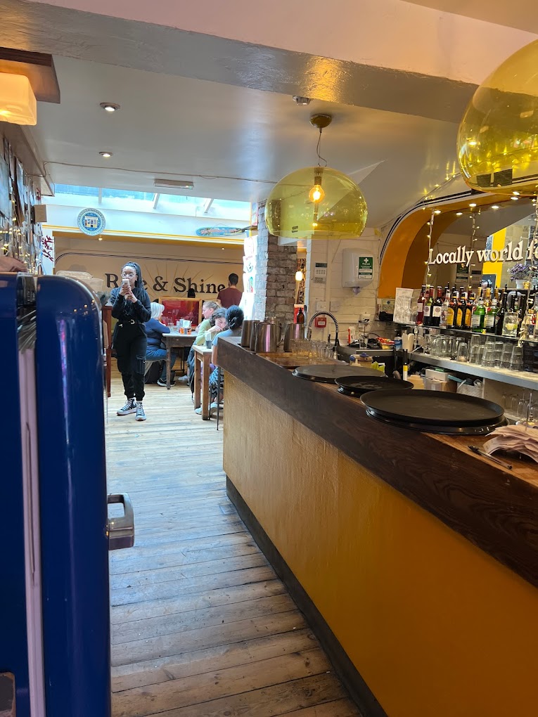 Vibrant café interior with natural light, perfect for networking events and meetings.