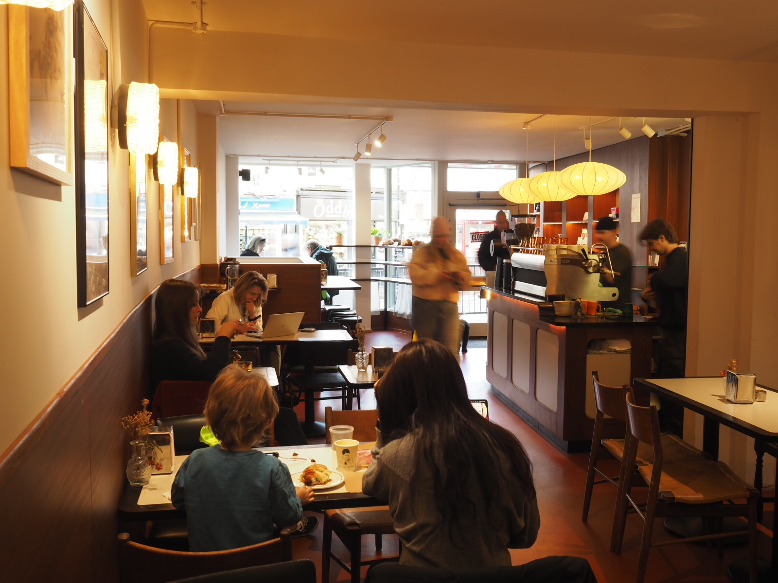 Cozy café with warm lighting, perfect for networking and informal meetings.