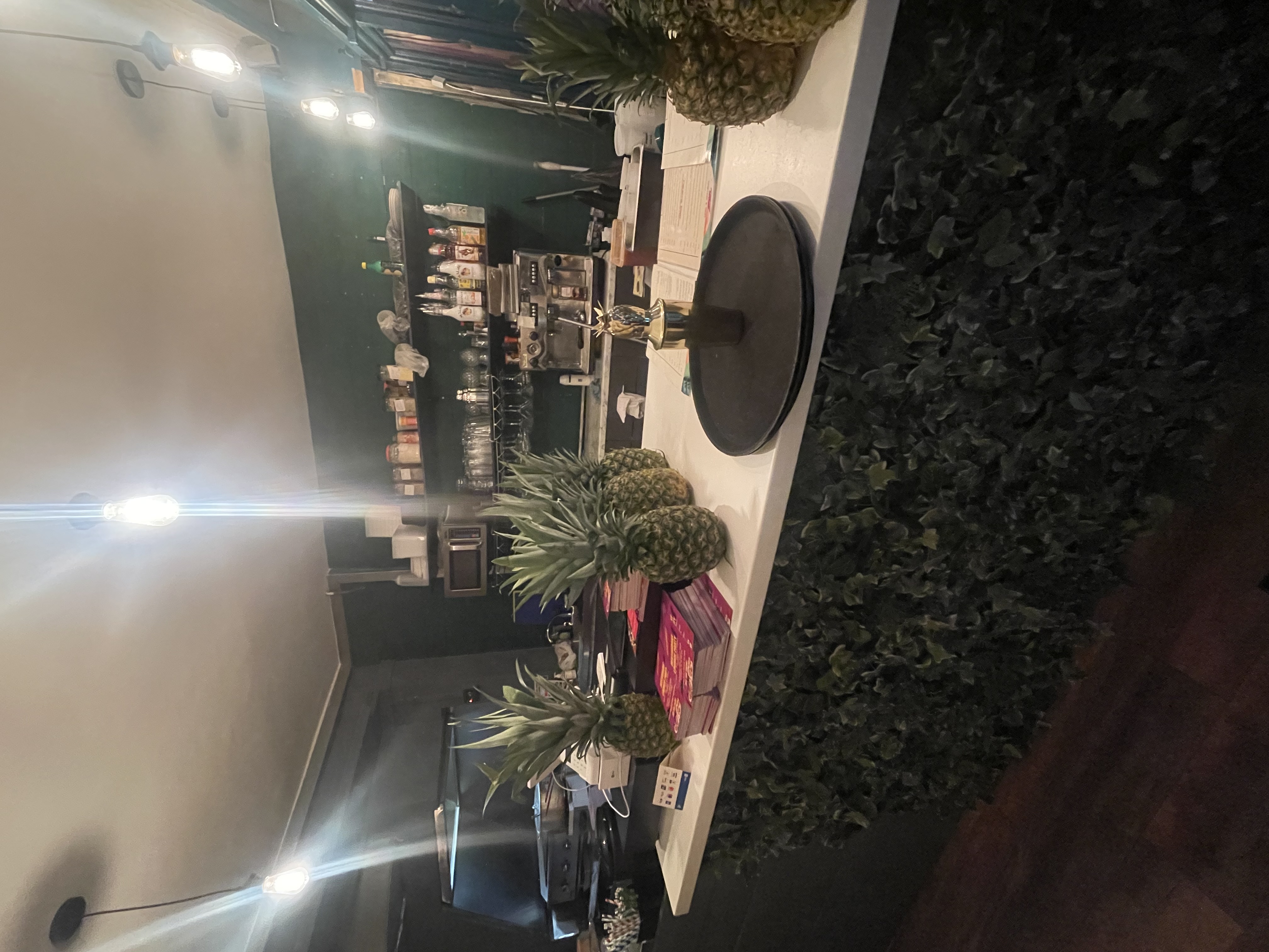 Vibrant Pineapple Xpress bar with fresh pineapples, ideal for cocktail receptions and gatherings.