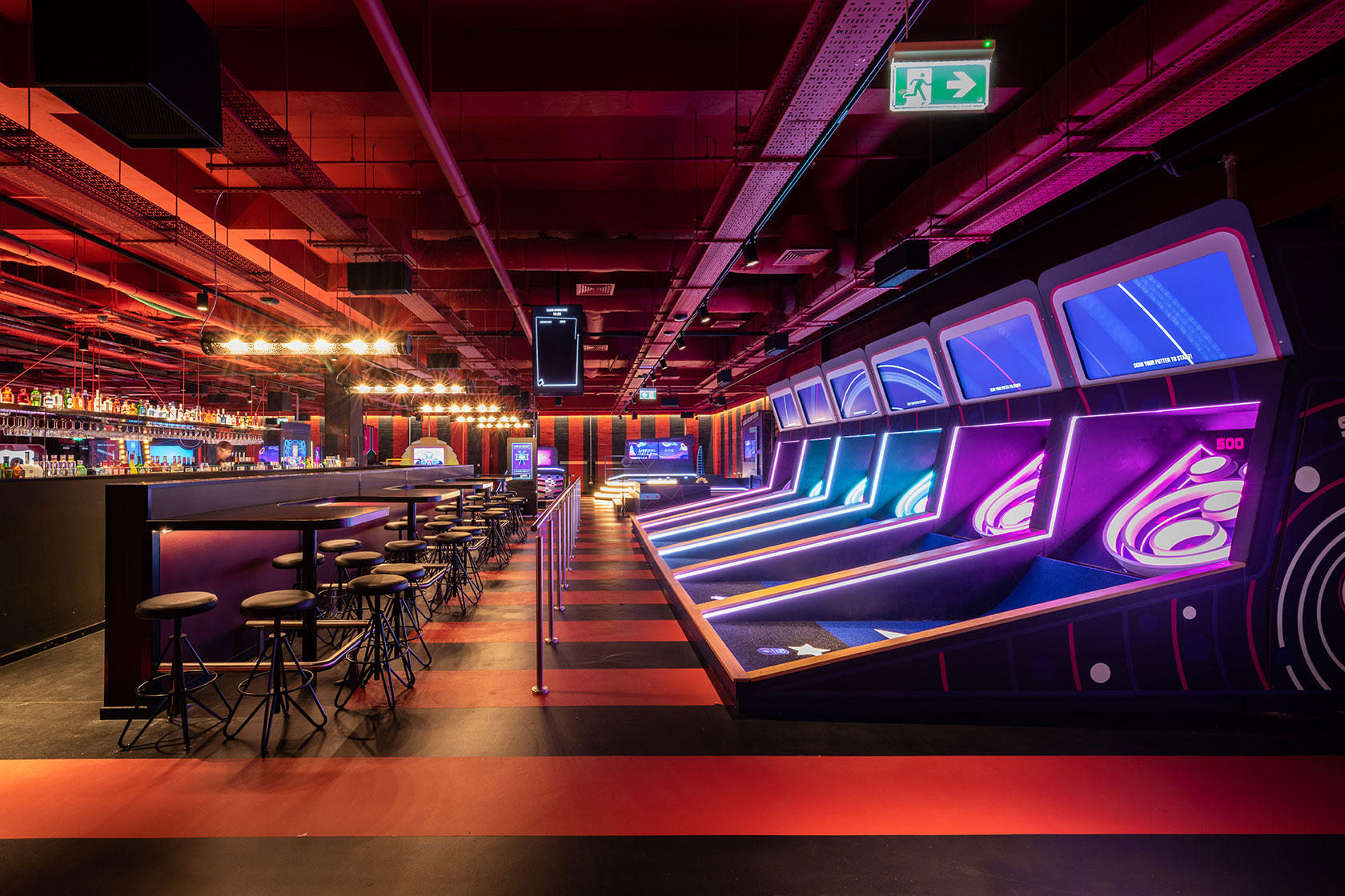 Putters Tech mini golf venue with vibrant lighting for corporate events and social gatherings.