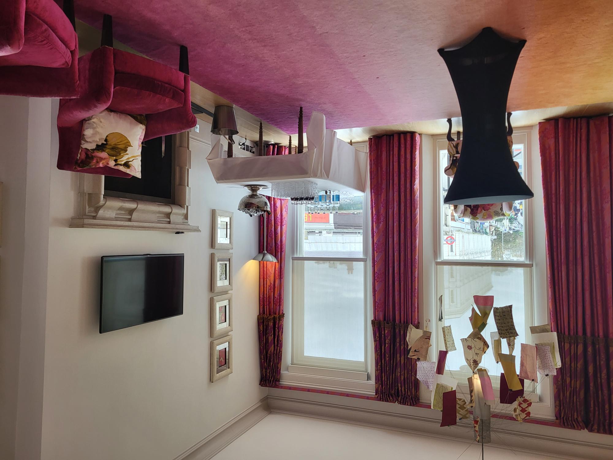 Stylish meeting space at The Pelham Hotel with vibrant curtains for intimate gatherings.