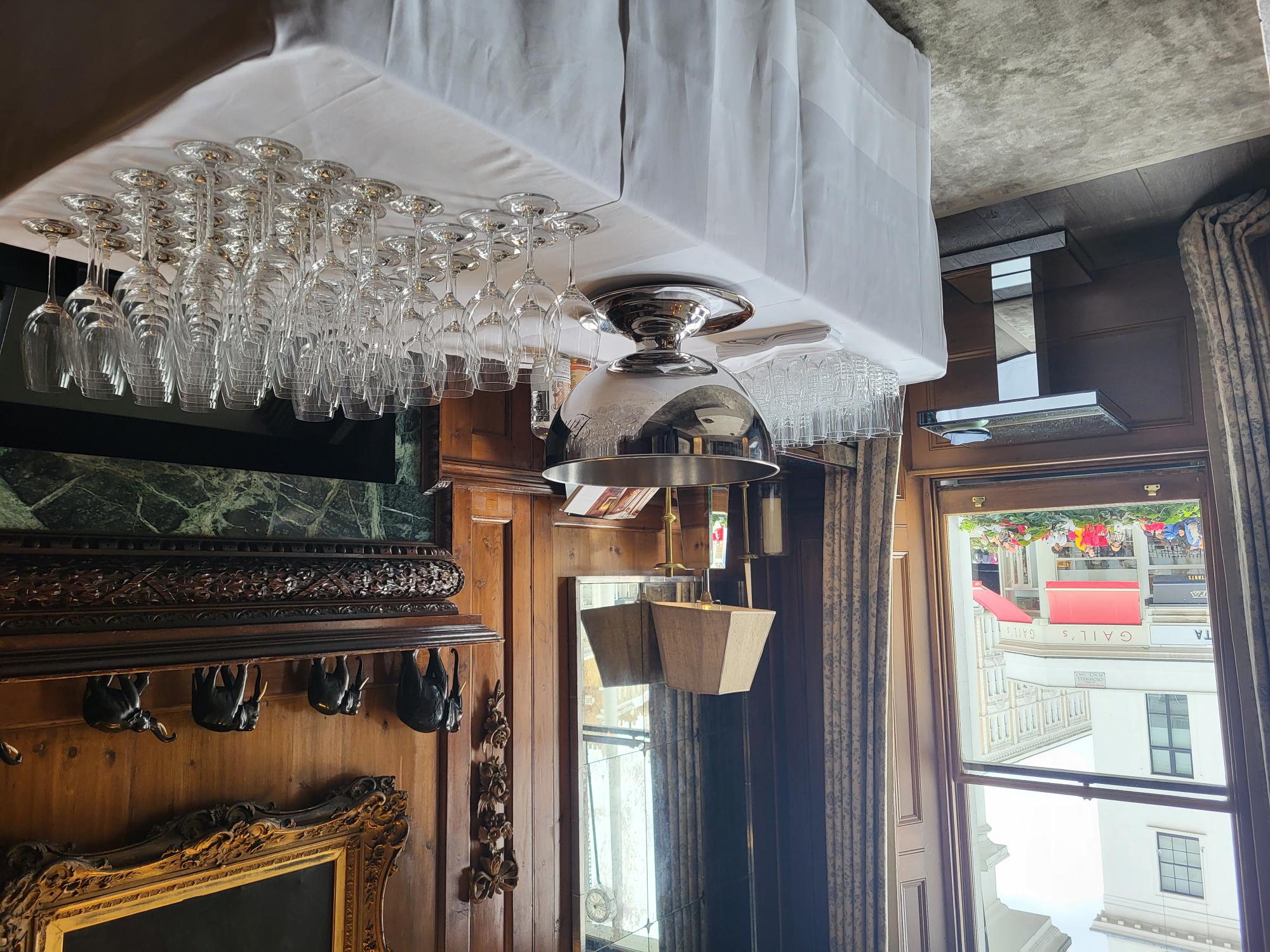 Elegant event setup in The Drawing Room, Pelham Hotel with polished glassware and decor.