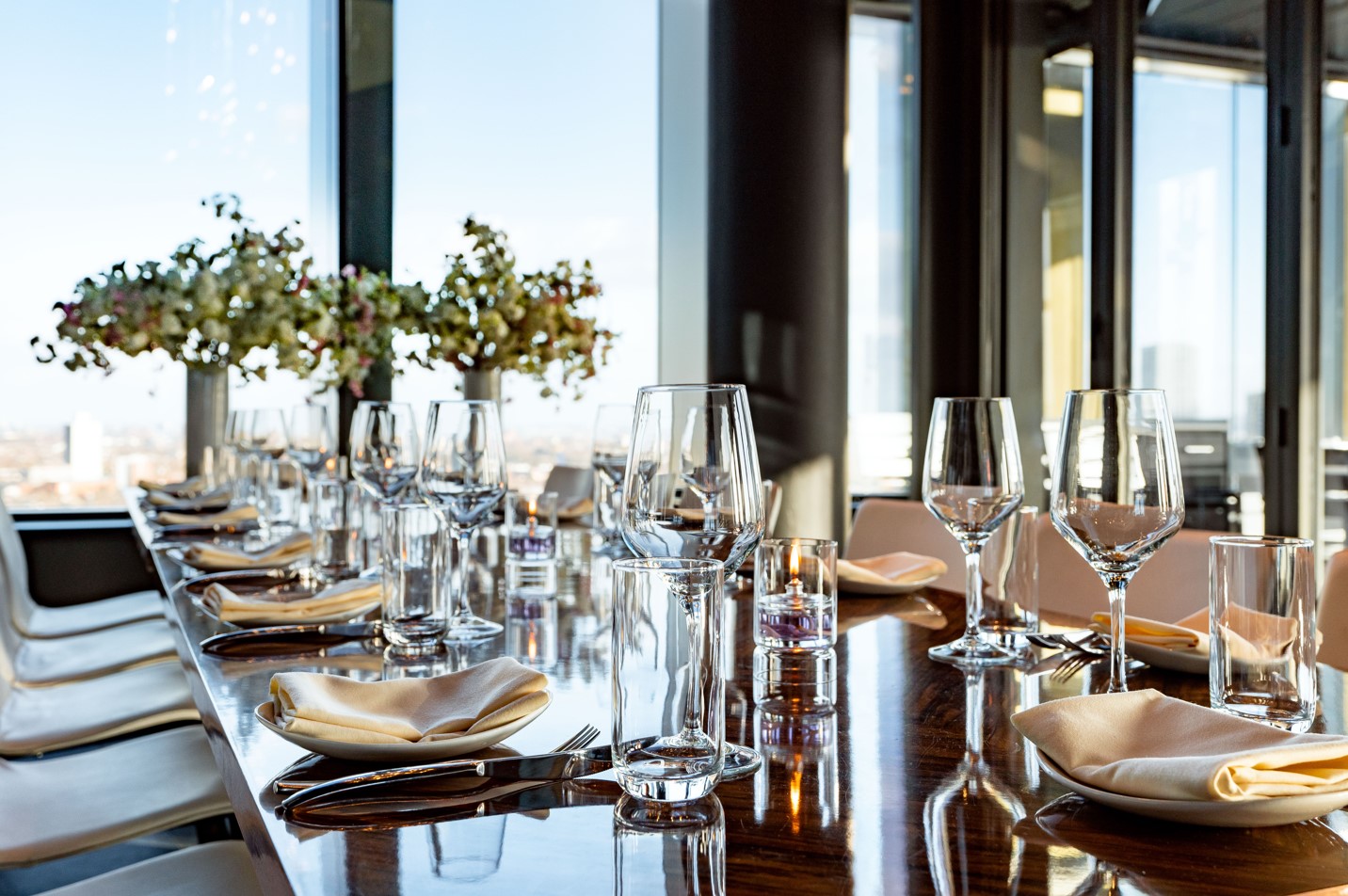 Private dining room at STK Rooftop Stratford with elegant table setup for upscale events.