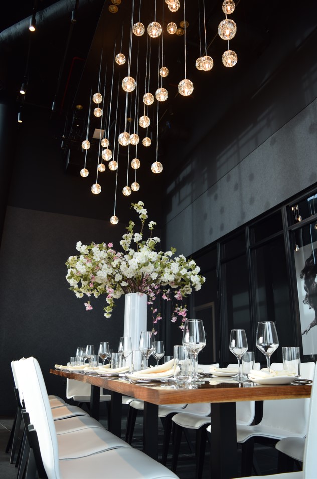 Private dining room at STK Rooftop Stratford with elegant table setting for upscale events.