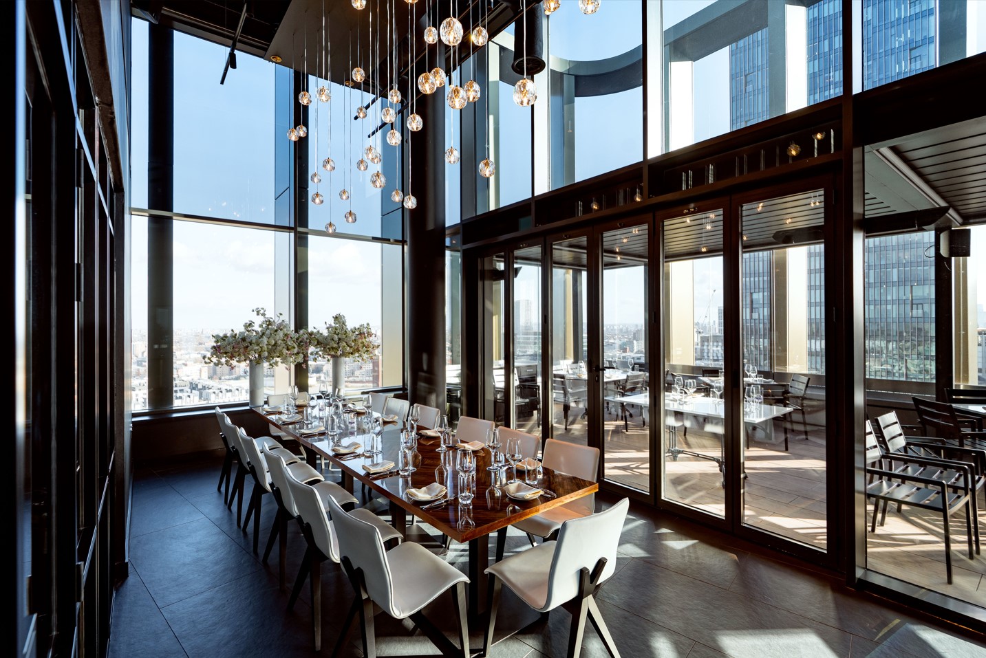 Private dining room at STK Rooftop Stratford, ideal for corporate meetings and gatherings.