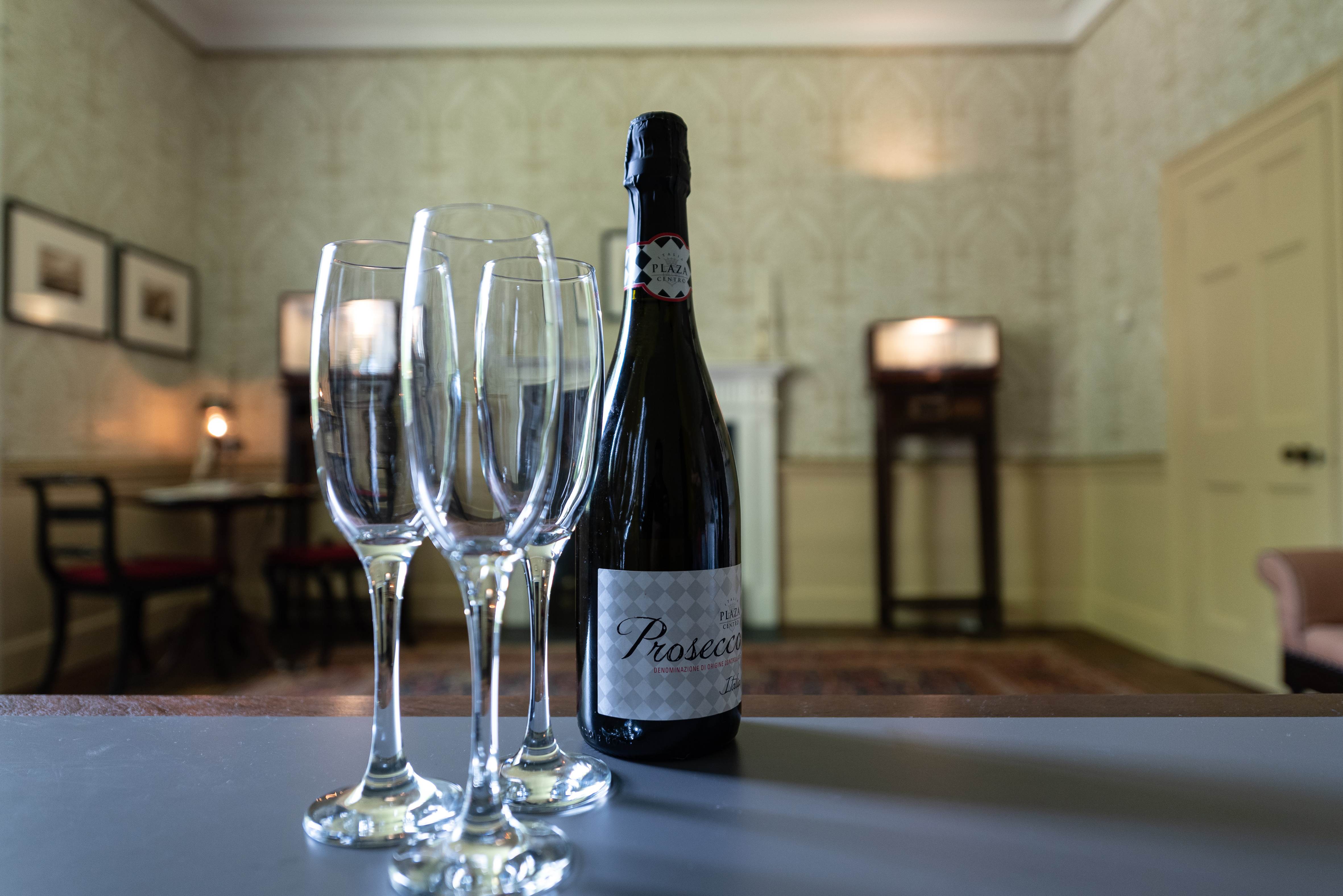 Elegant venue setup with champagne flutes for milestone celebrations and networking events.