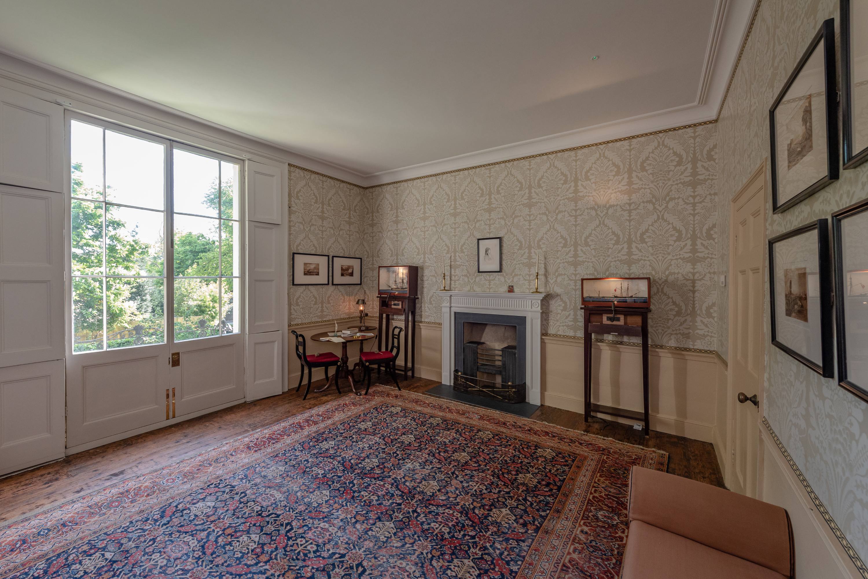 Elegant meeting space in Turner's House with natural light and cozy ambiance.