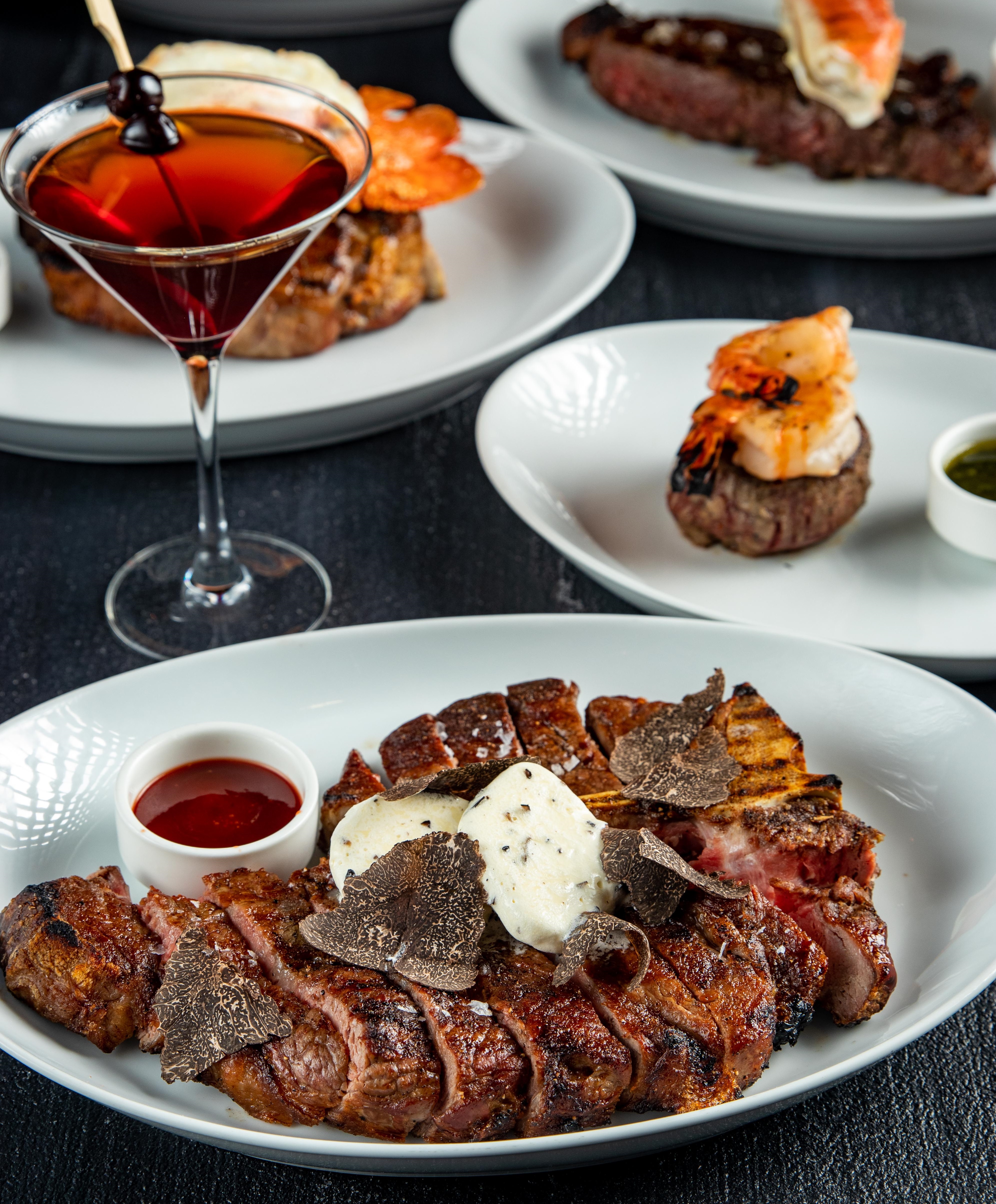 Private dining gourmet meal with elegant garnishes at STK Rooftop Stratford event.