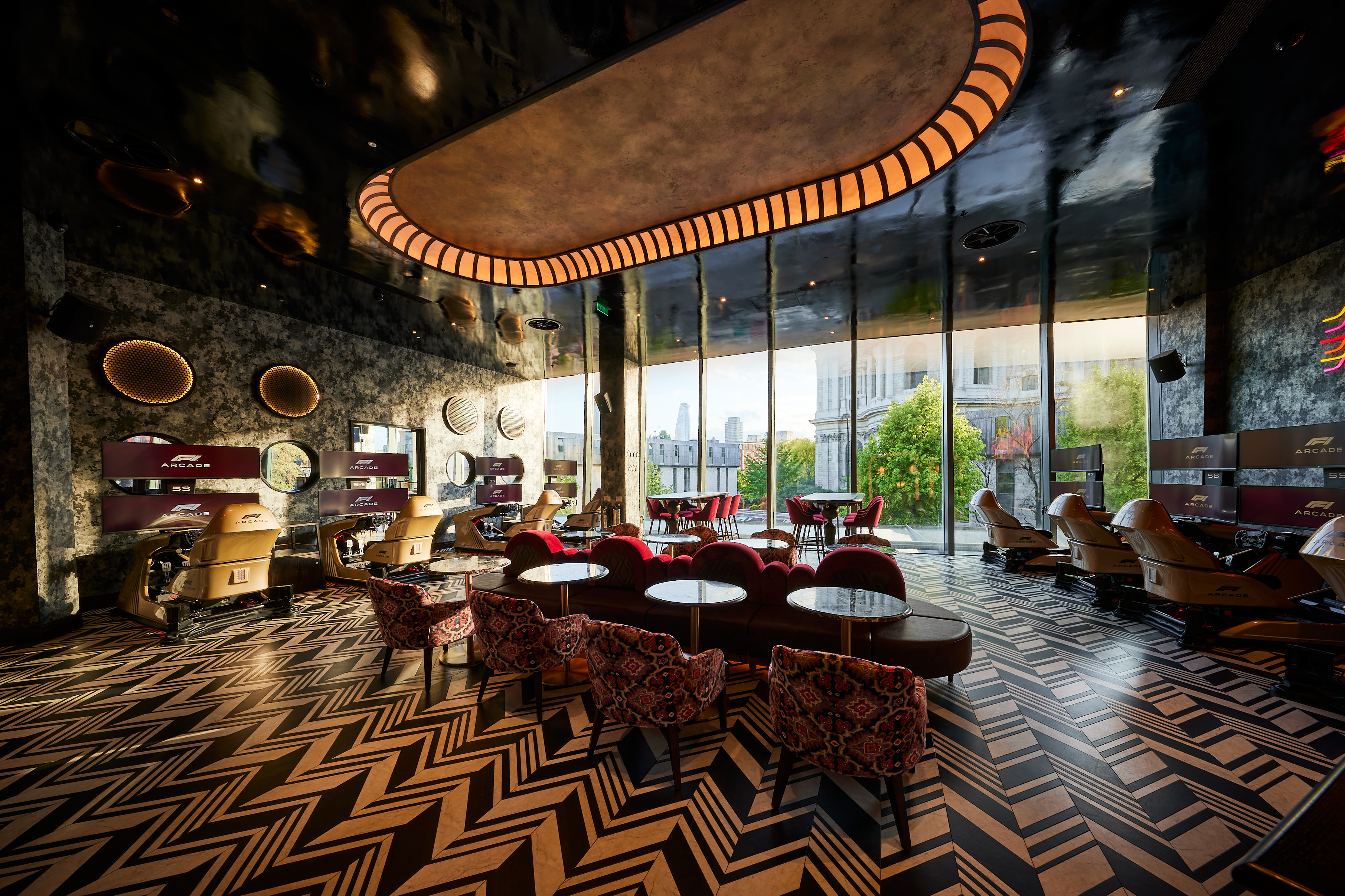 Stylish F1 Arcade Briefing Room with luxurious seating for networking events.