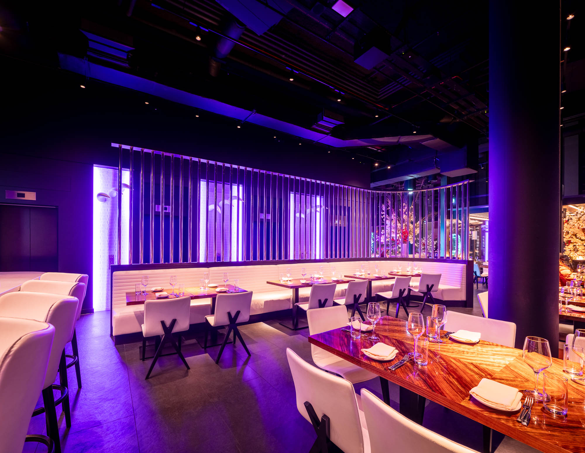Modern dining space at STK Rooftop Stratford, perfect for corporate dinners and celebrations.