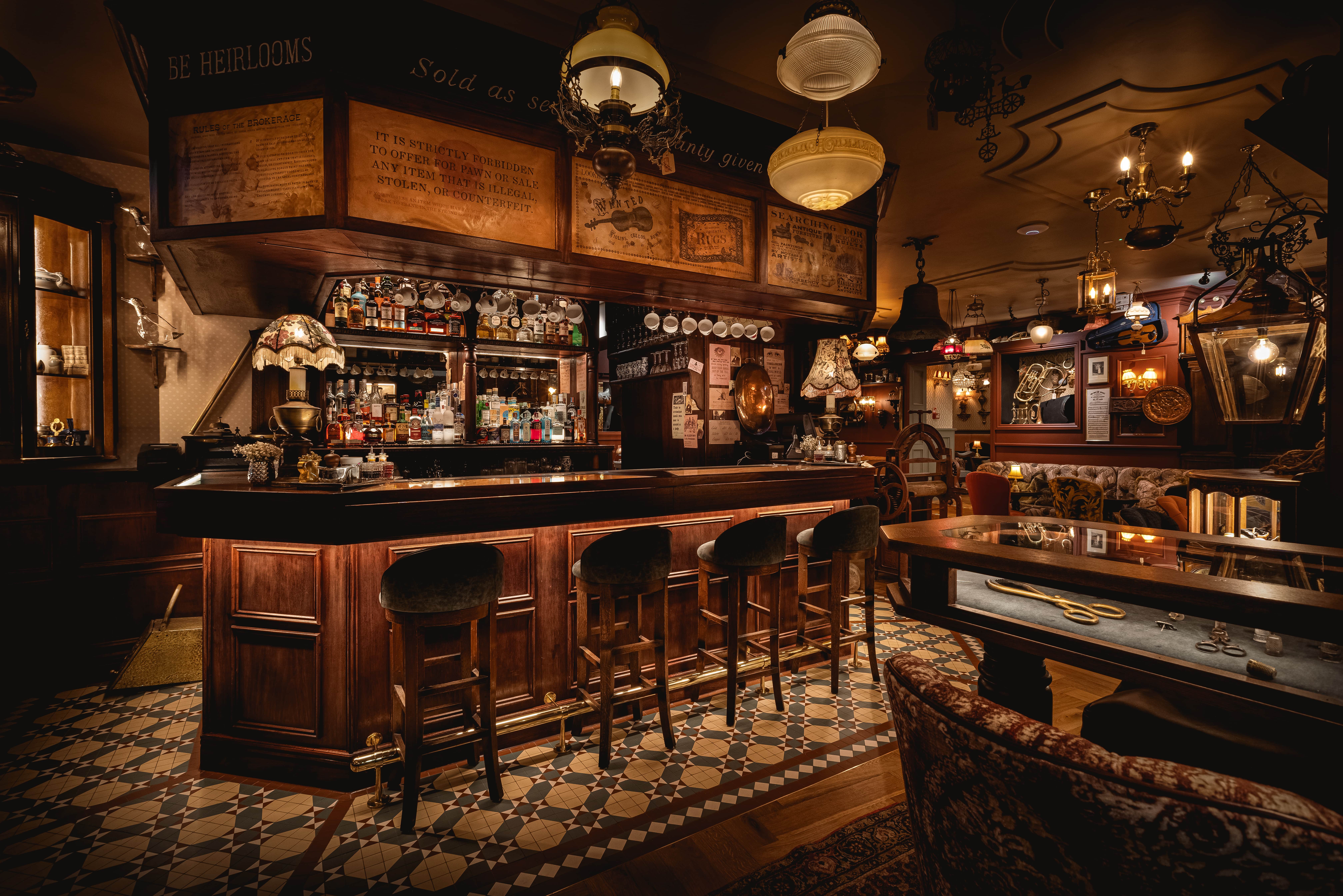 Vintage bar venue hire with warm wood finishes, perfect for intimate gatherings and networking.