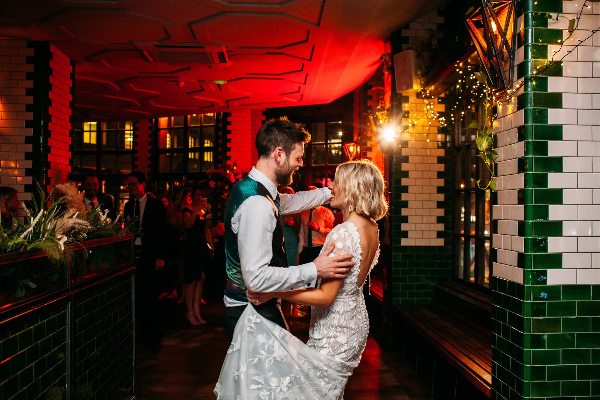 Main Bar in Singer Tavern, couples dancing under warm lighting, ideal for weddings and events.