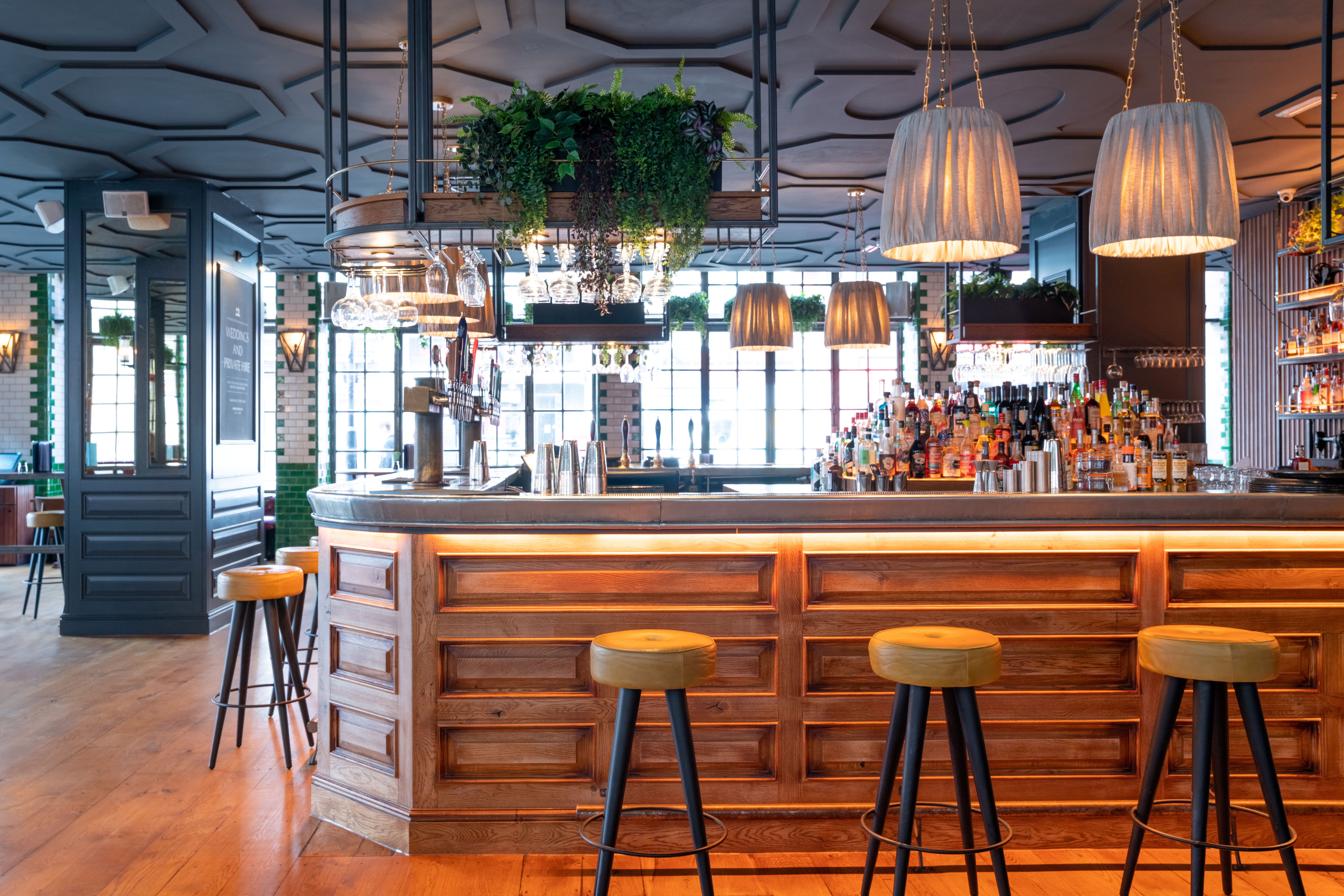 Stylish bar area in Singer Tavern, ideal for networking events and casual gatherings.