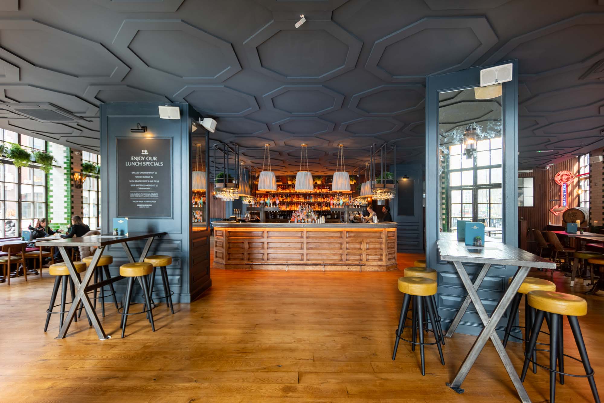 Main Bar at Singer Tavern: modern venue with high-top tables for receptions and cocktail hours.