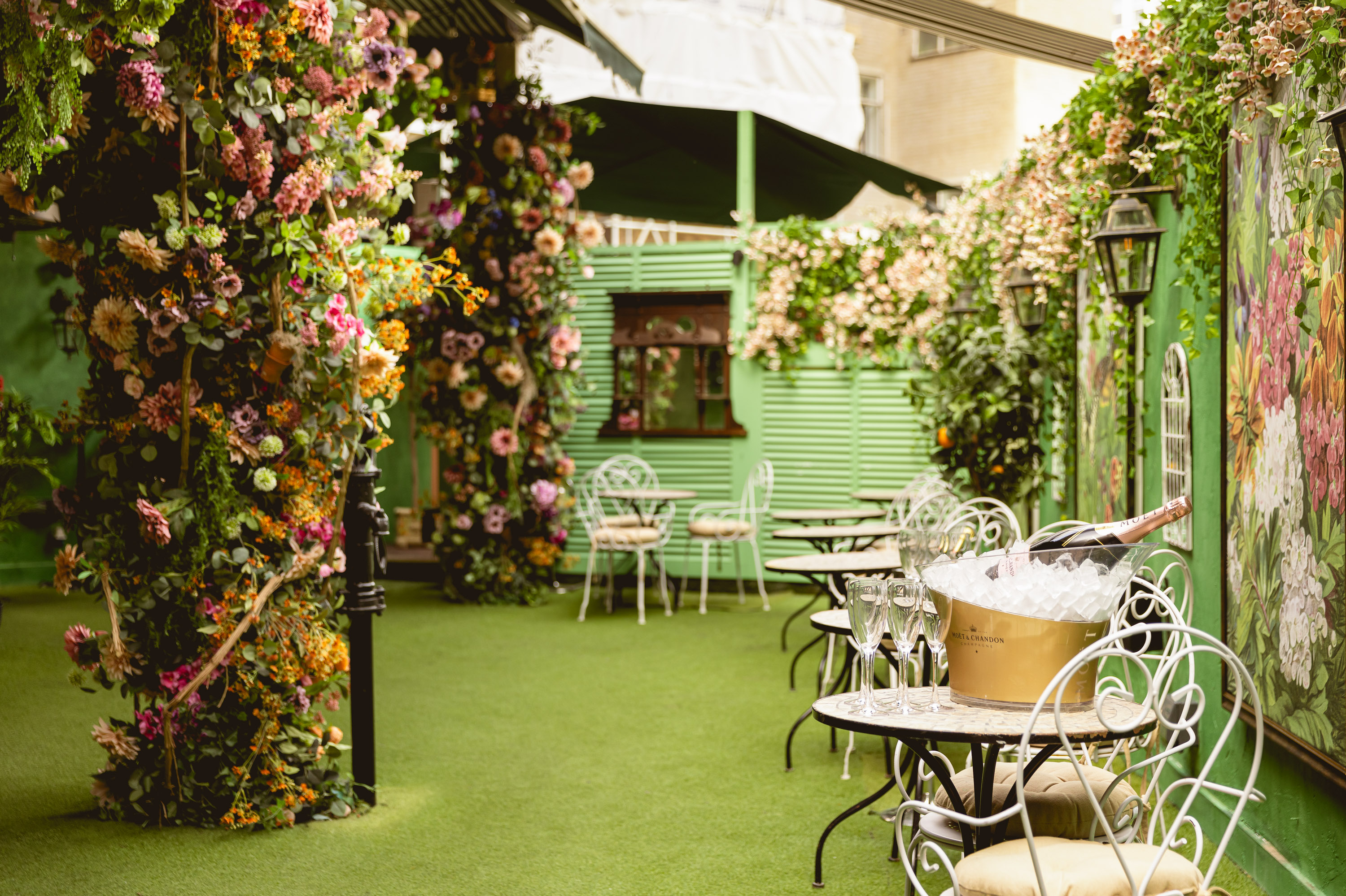 Mr Fogg's Secret Garden venue with lush flowers, perfect for upscale garden parties.