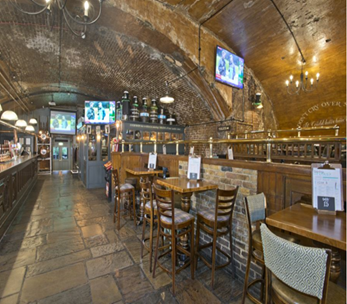 Rustic brick-arched venue in The Minories for casual gatherings and corporate events.
