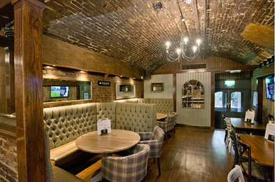Cozy venue with warm brick walls for intimate meetings and small events.