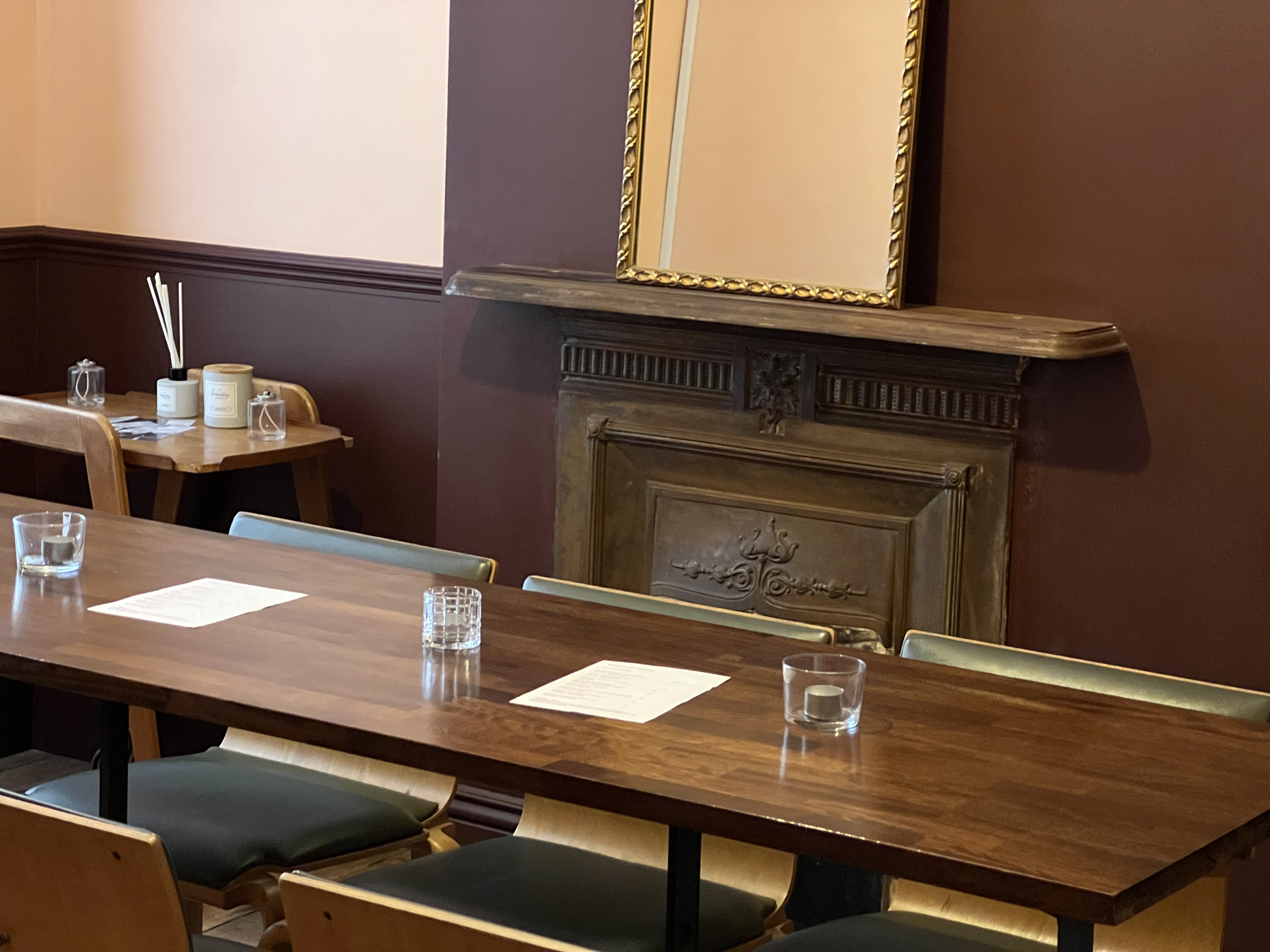 Cozy private dining room with wooden table, perfect for intimate gatherings and meetings.