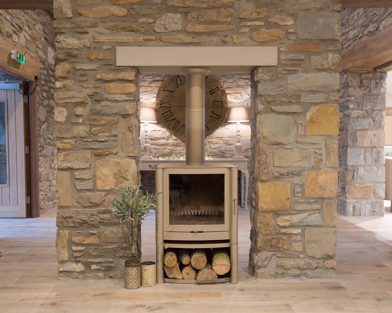 Cozy rustic venue with modern wood stove, perfect for intimate gatherings and events.