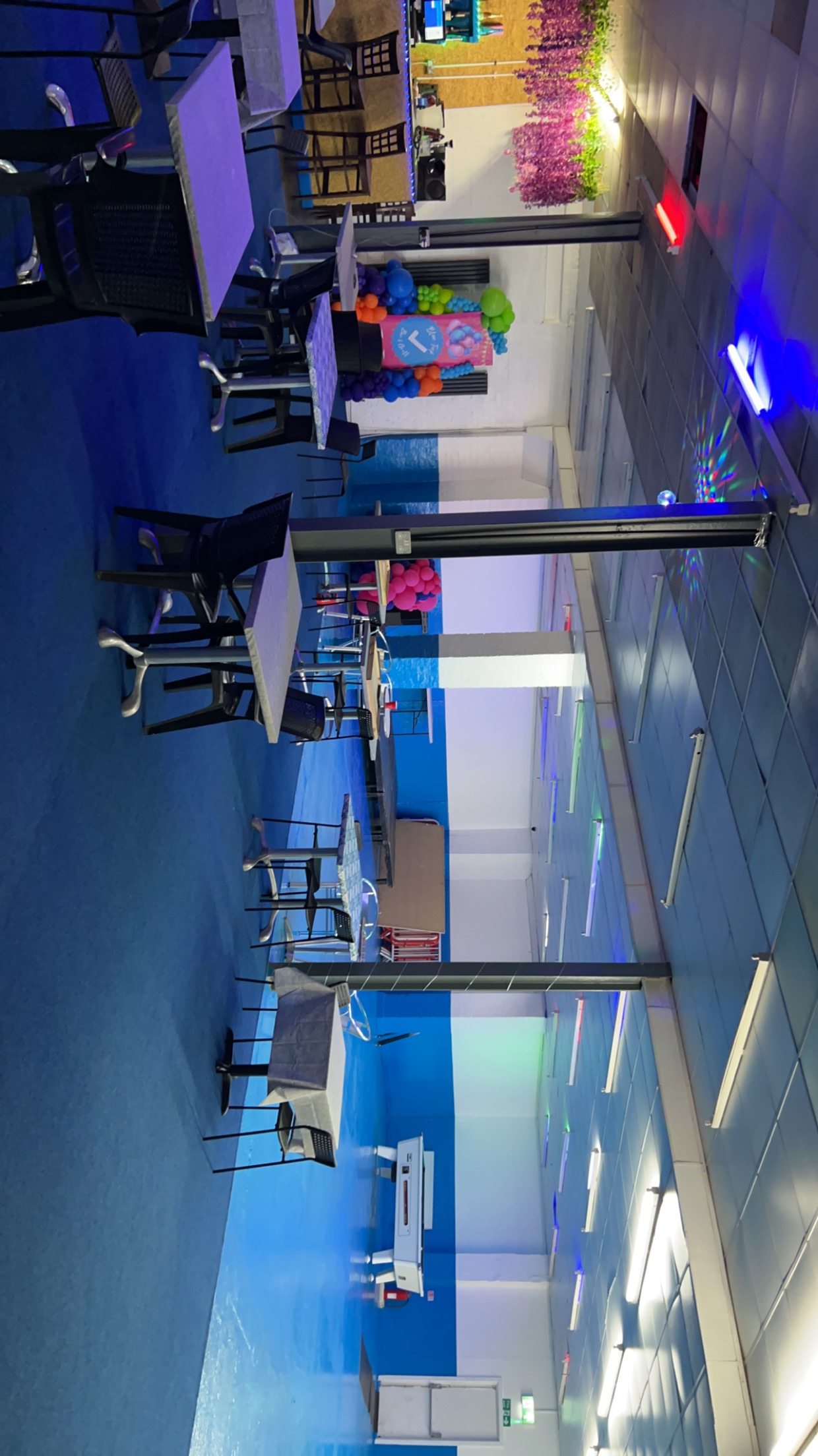 Blue Tick Bar and Grill event space with blue flooring for meetings and gatherings.