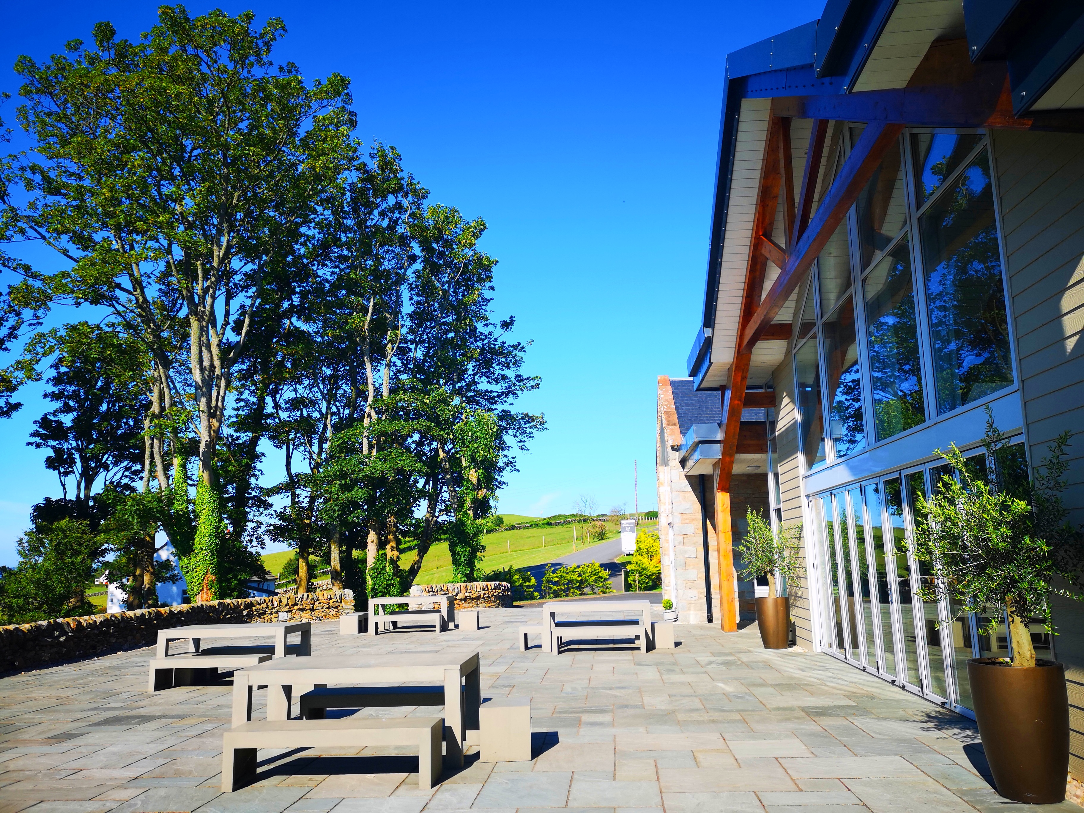Ceremony Wing at GG's Yard: spacious outdoor venue with ample seating for events.
