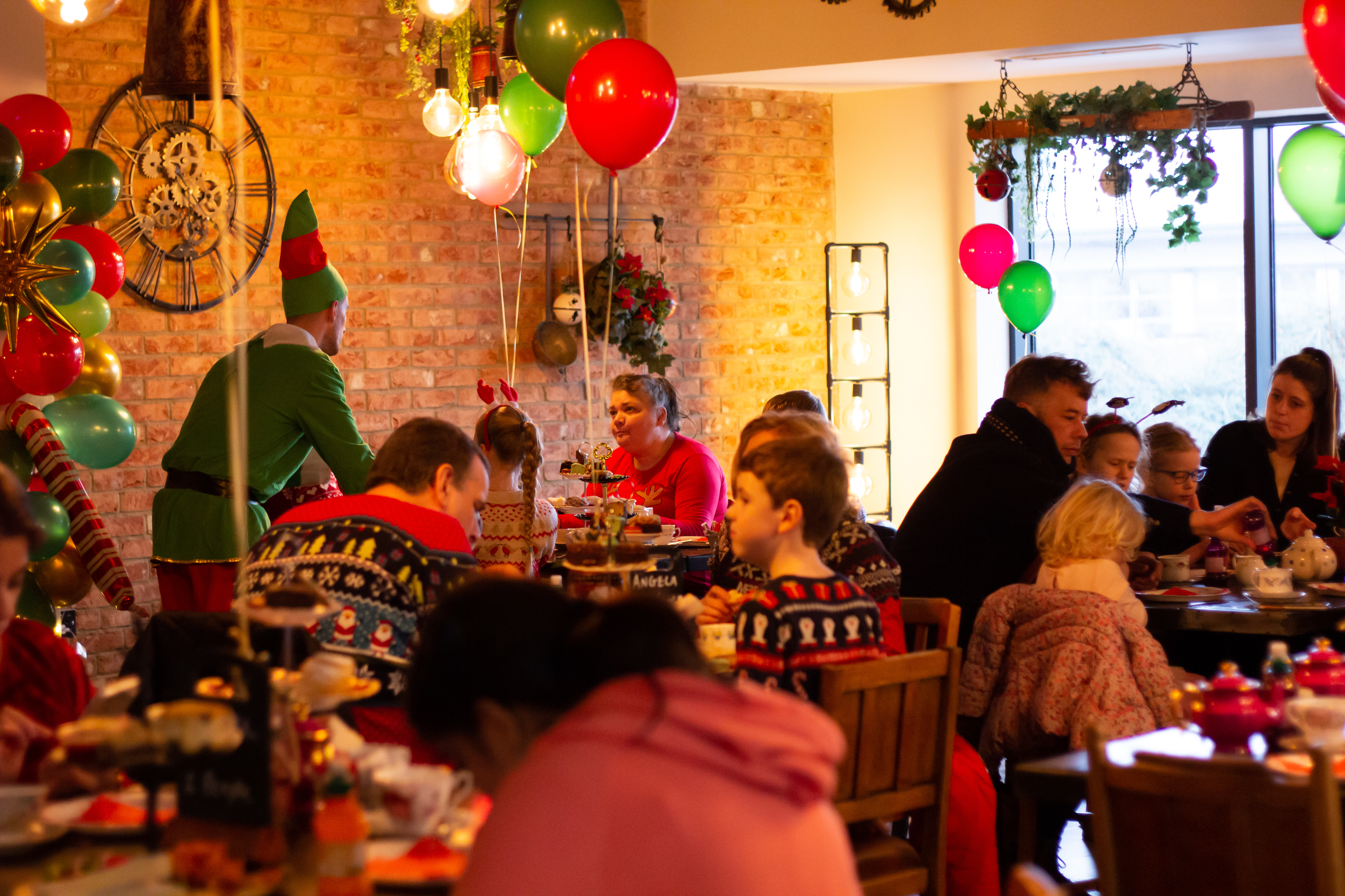 Festive gathering at Rising Cafe in Anchor Point, ideal for holiday events and family fun.