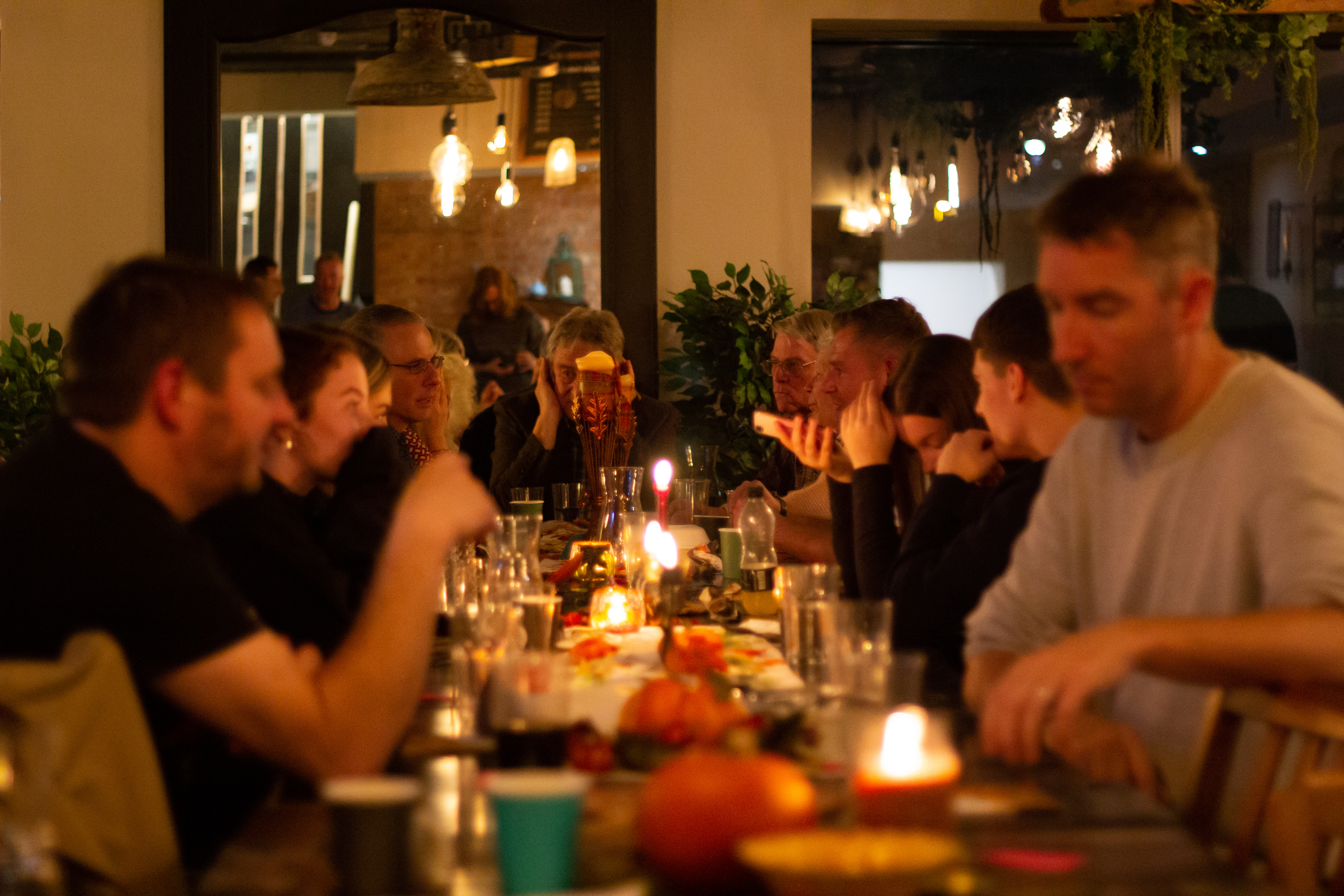 Rising Cafe gathering with warm lighting, ideal for networking and team-building events.
