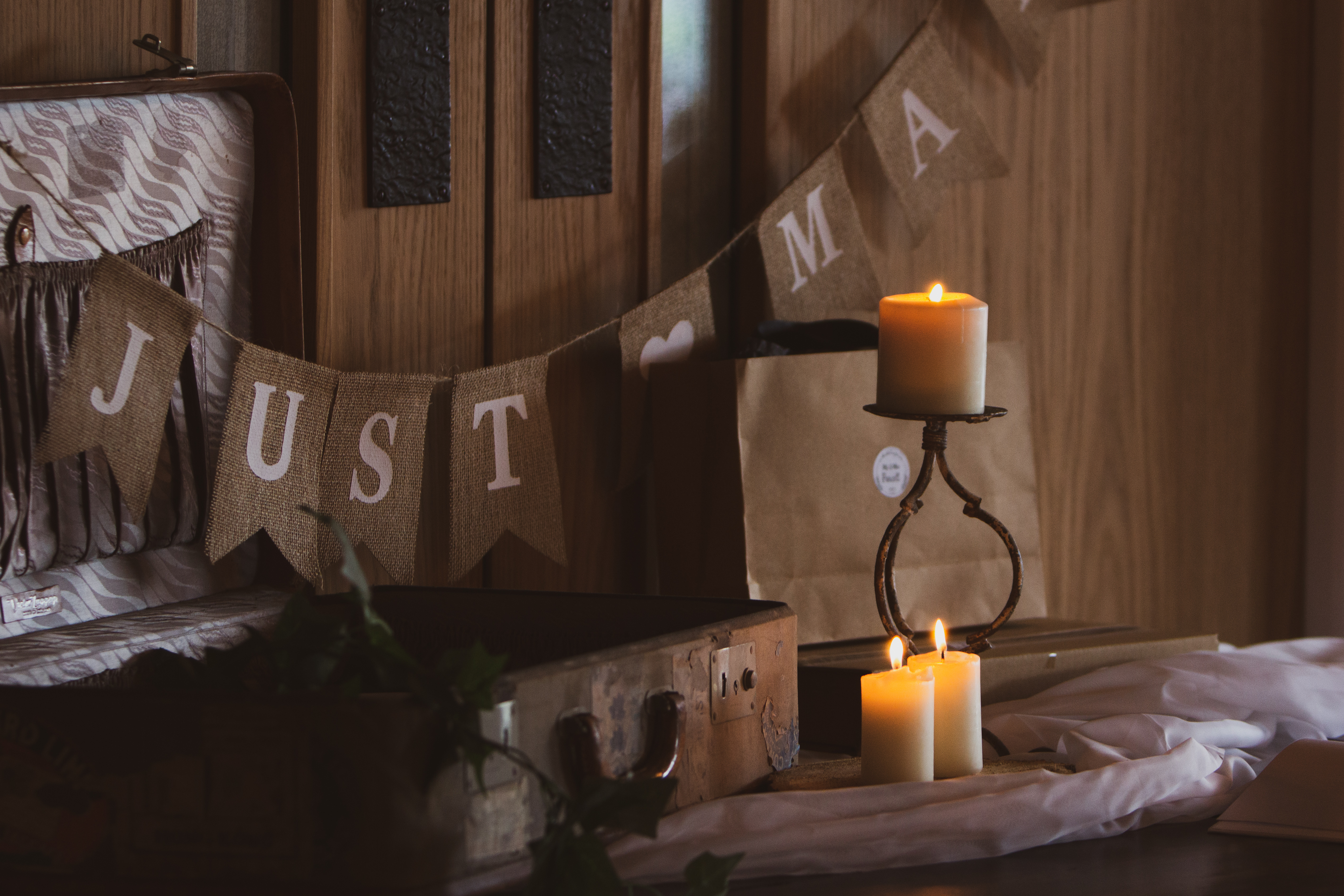 Rising Cafe wedding setup with rustic decor and "JUST MARRIED" banner.