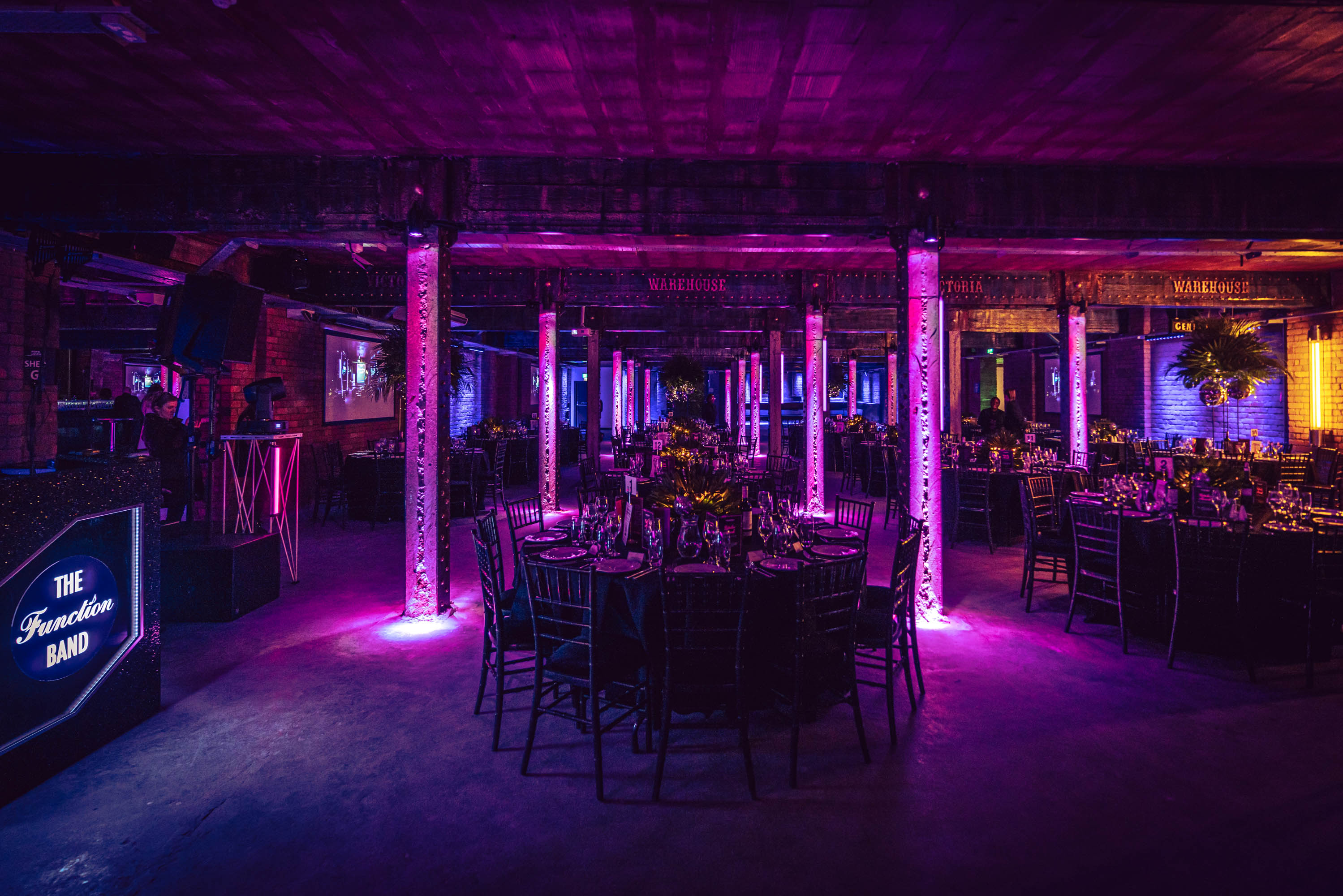 Stylish event space at Tobacco Stores with elegant tables and vibrant lighting for upscale gatherings.