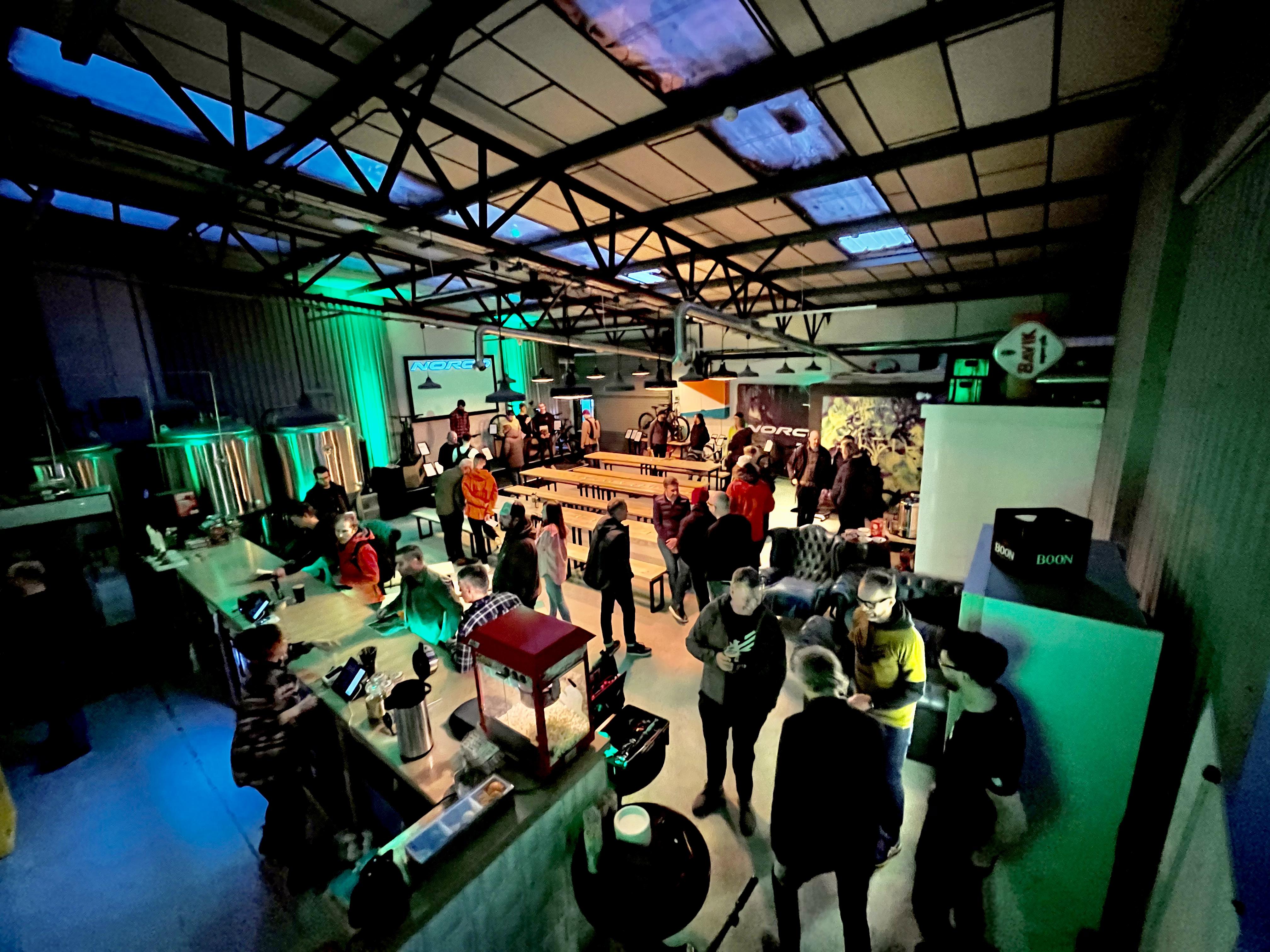 Brewery event space with vibrant attendees networking at Halton Turner Brewing Co.