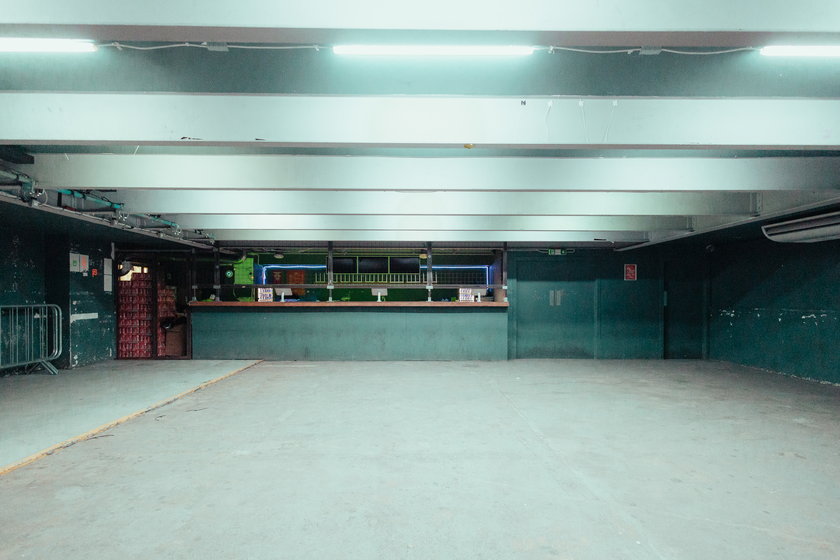 Versatile event space at The Cause with industrial aesthetic, ideal for social gatherings.