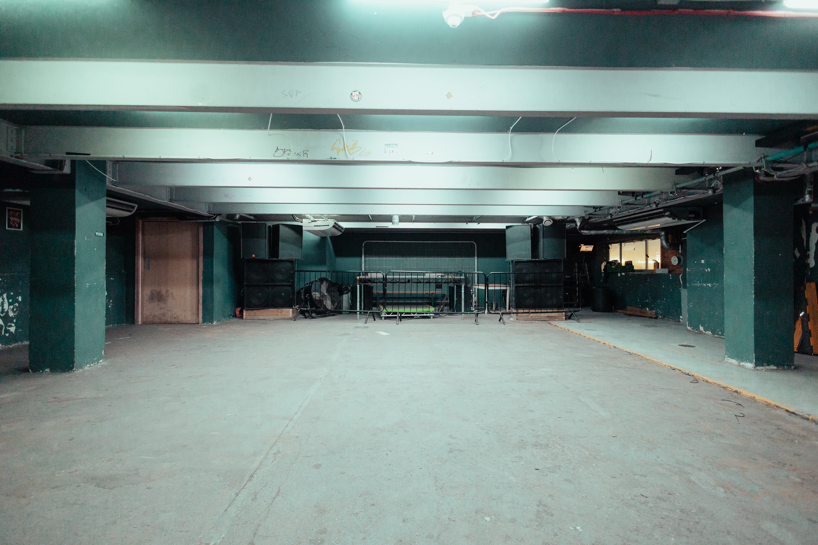 Spacious industrial venue with exposed beams for versatile events at The Cause, 60 Dock Road.