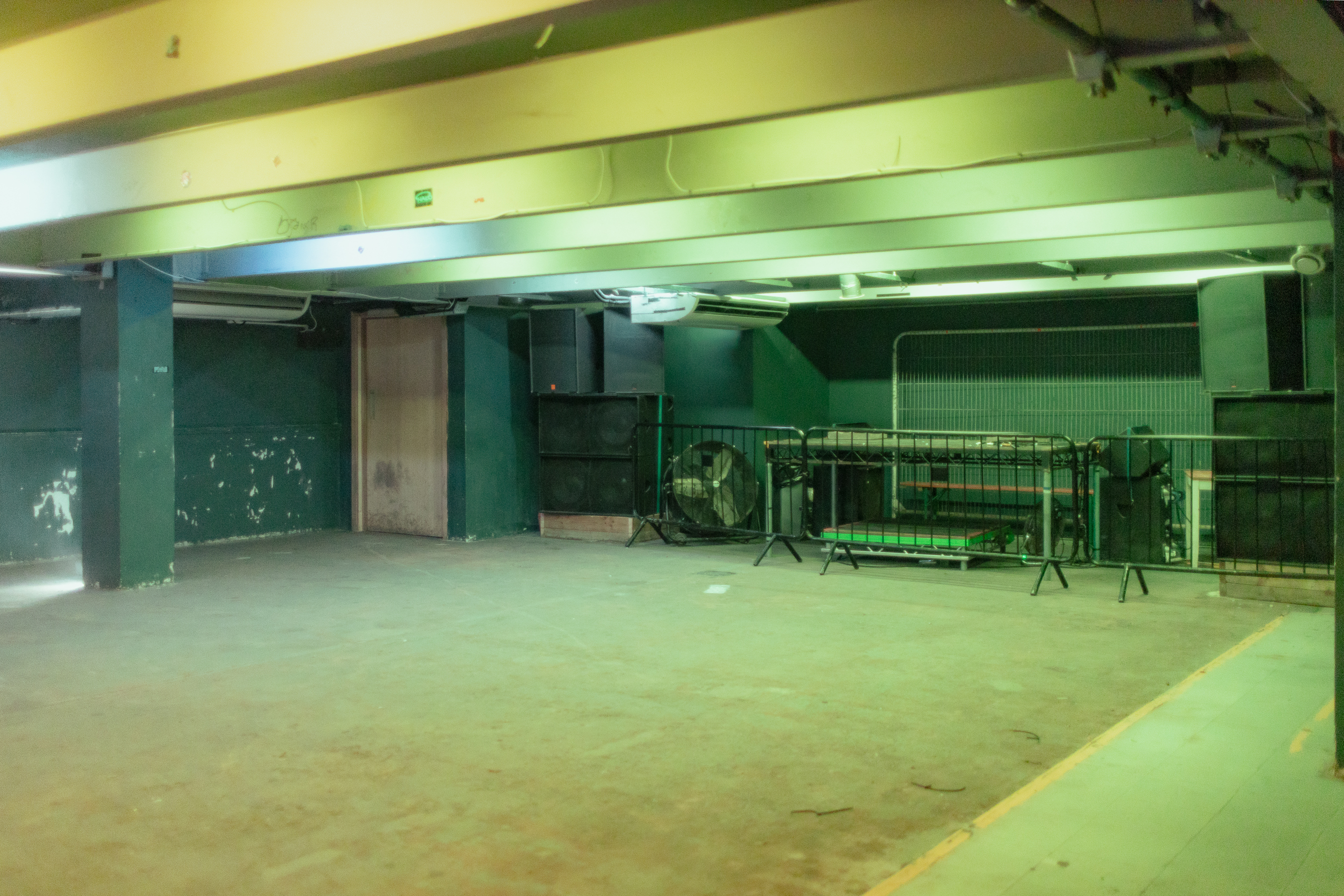 Versatile raw event space at The Cause with industrial aesthetic for creative setups.