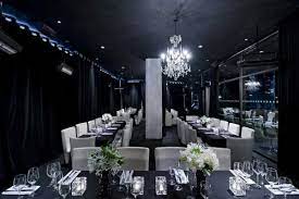 Elegant event space at The O2 with chandelier, perfect for upscale gatherings and meetings.