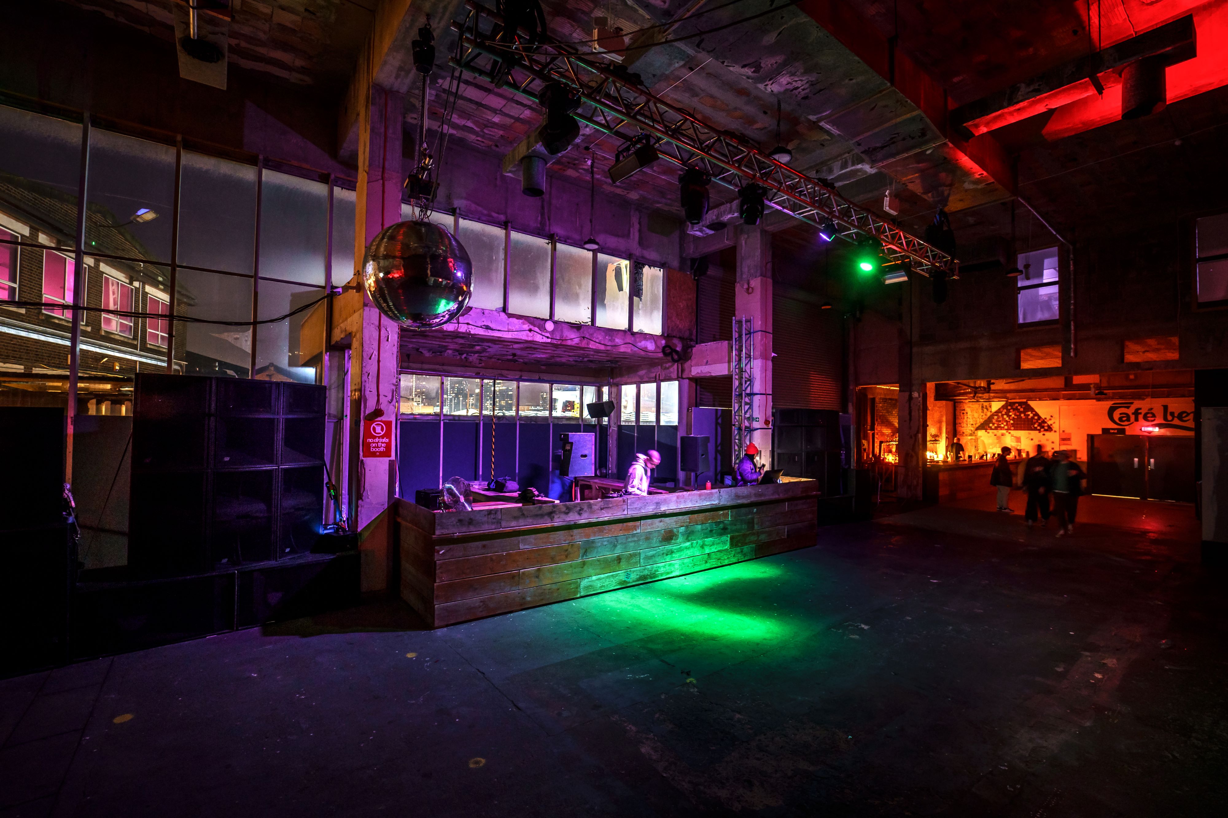 Versatile warehouse event space with dance floor, ideal for live music and corporate events.