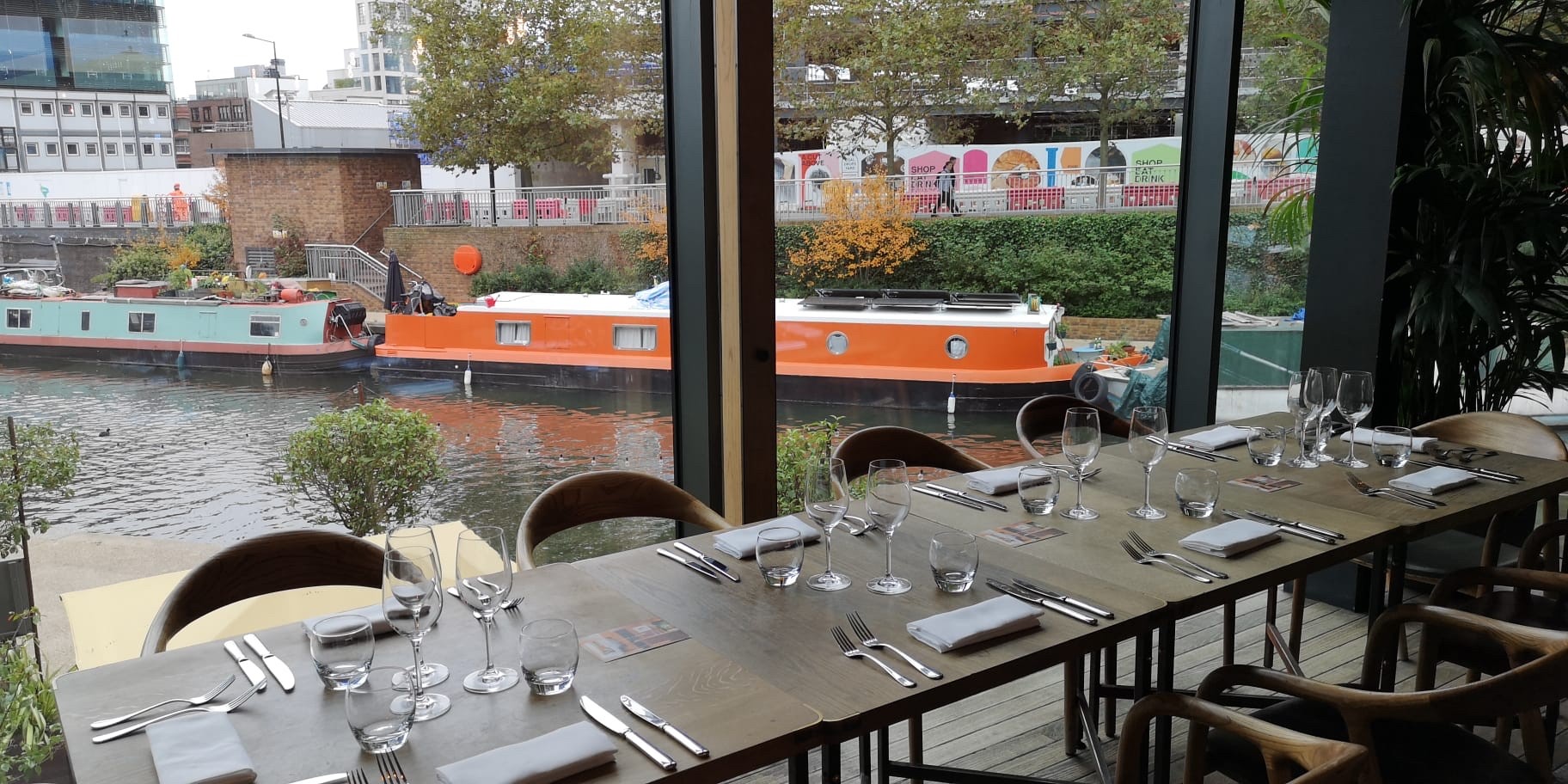 Elegant dining setup at The Lighterman with canal views for corporate events or gatherings.