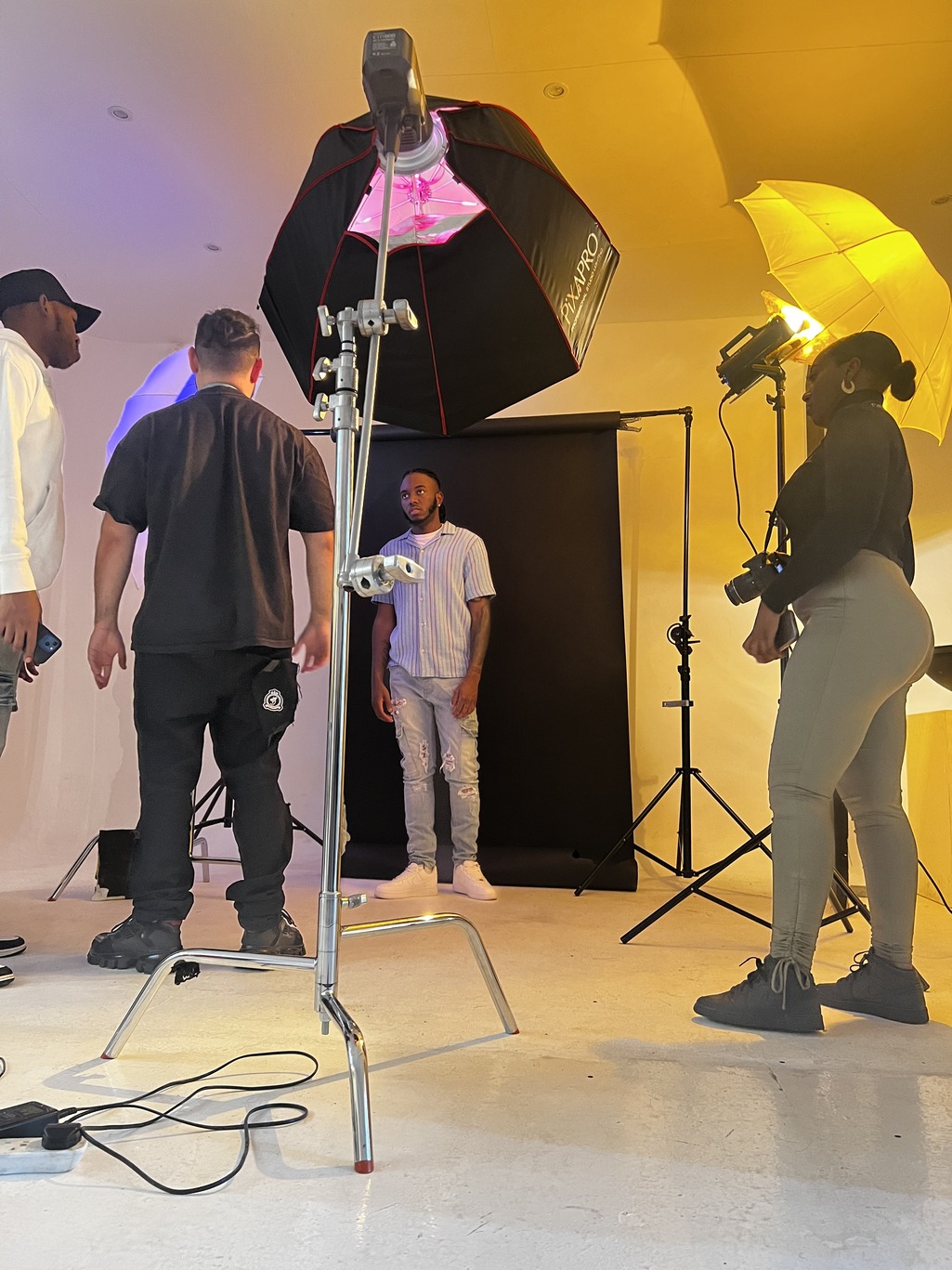 Dynamic photoshoot setup in White Room at Blankbox for event photography.