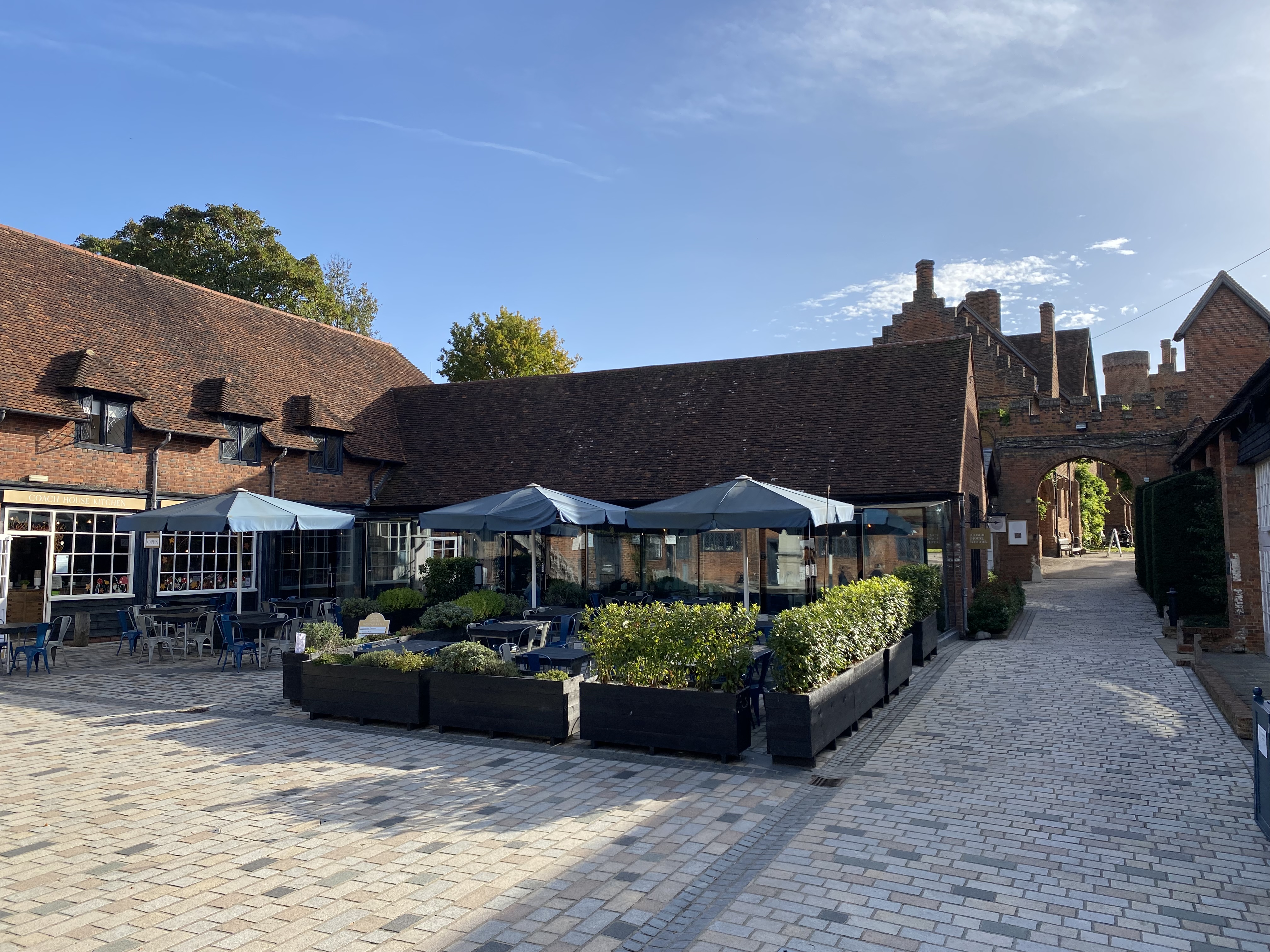 Charming outdoor venue at Coach House Kitchen, ideal for meetings and events.