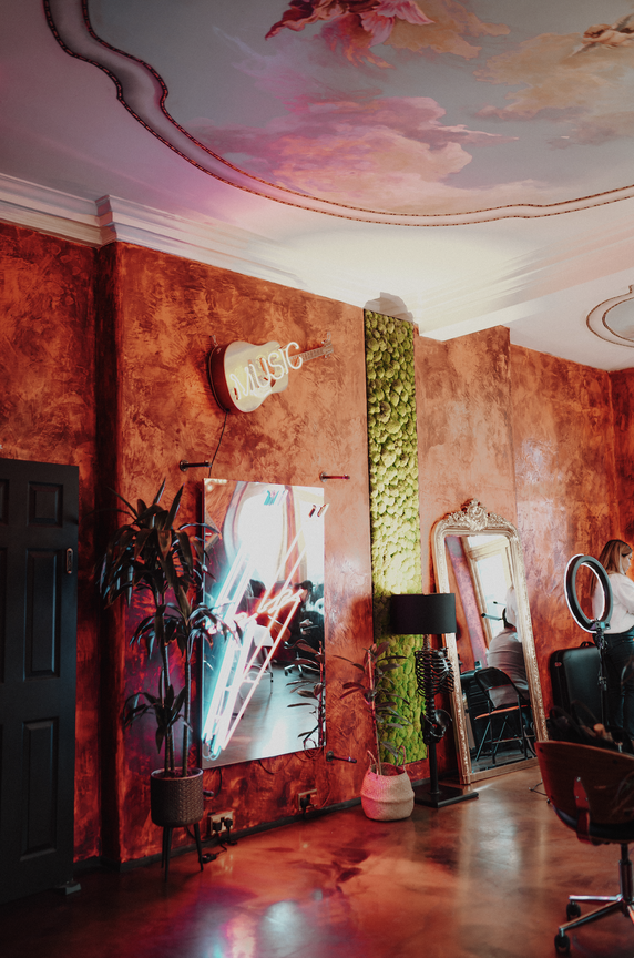 Creative event space with textured walls, ideal for networking and gatherings.