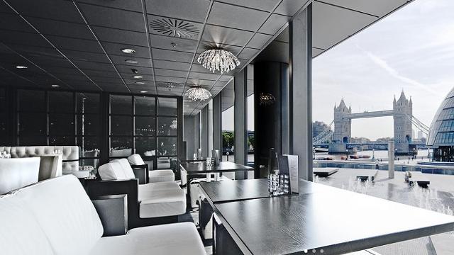 Sleek event space with large windows at Tower Bridge, perfect for corporate meetings.