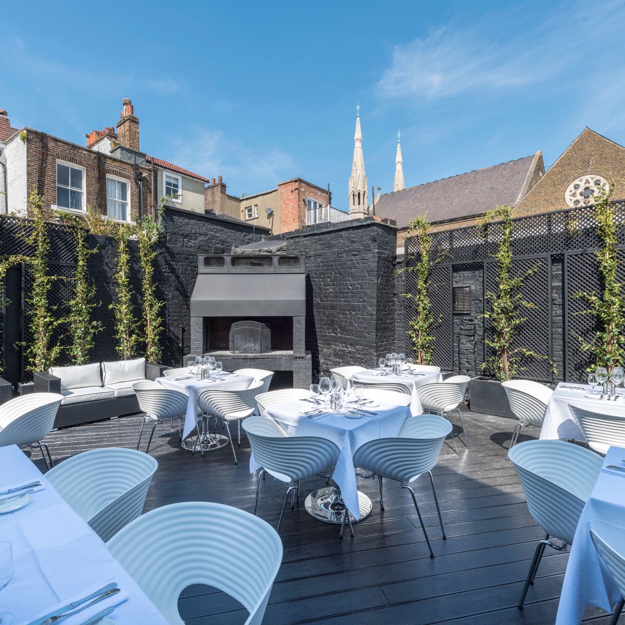 Stylish outdoor event space at Gaucho Hampstead with elegant furniture and greenery.
