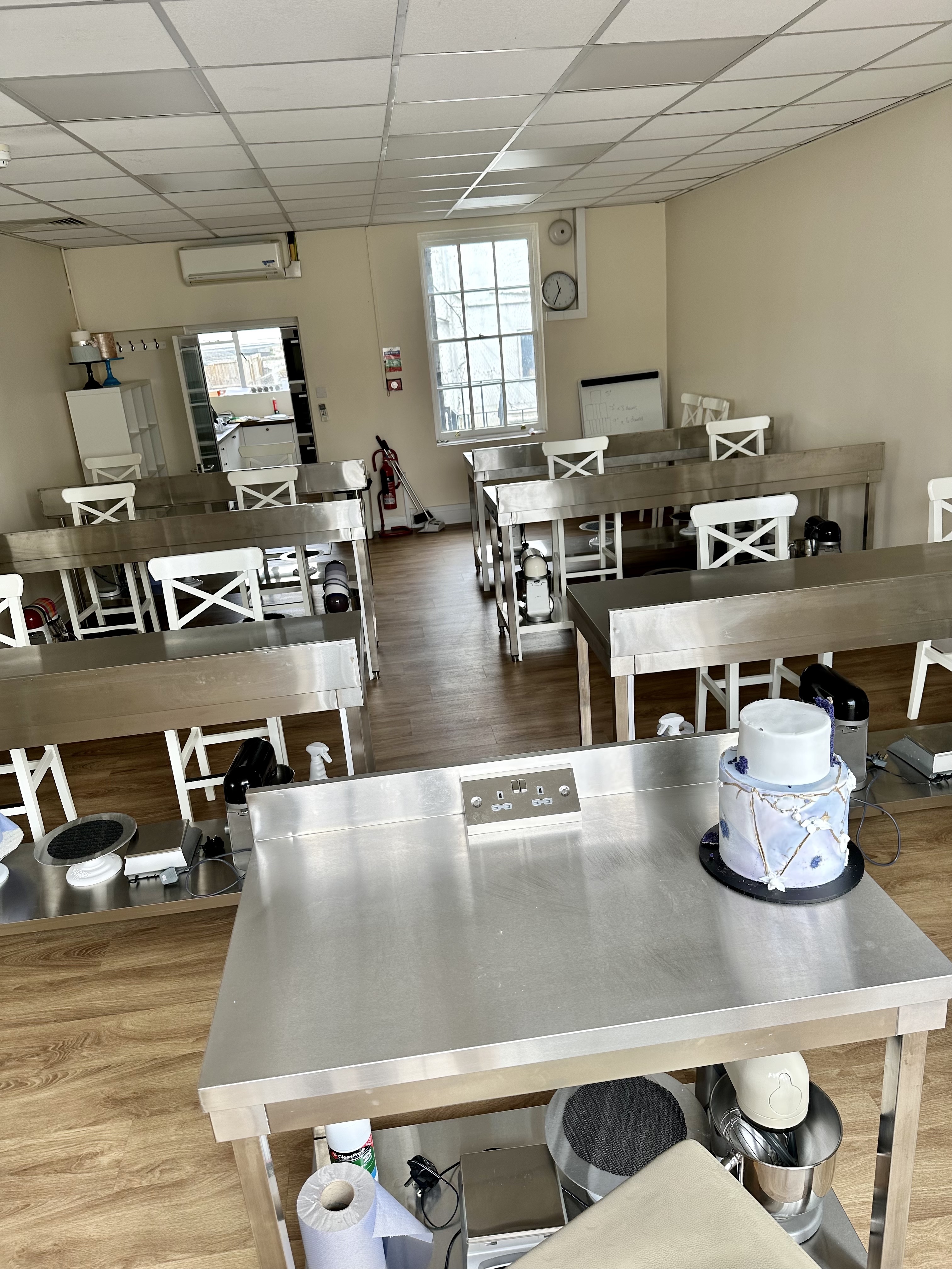 Modern workshop space with long tables and natural light for productive training sessions.