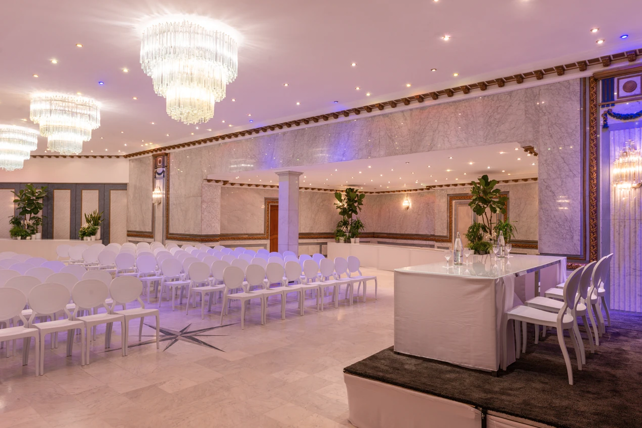 Elegant Salon Etoile venue with chandeliers, ideal for corporate events and conferences.