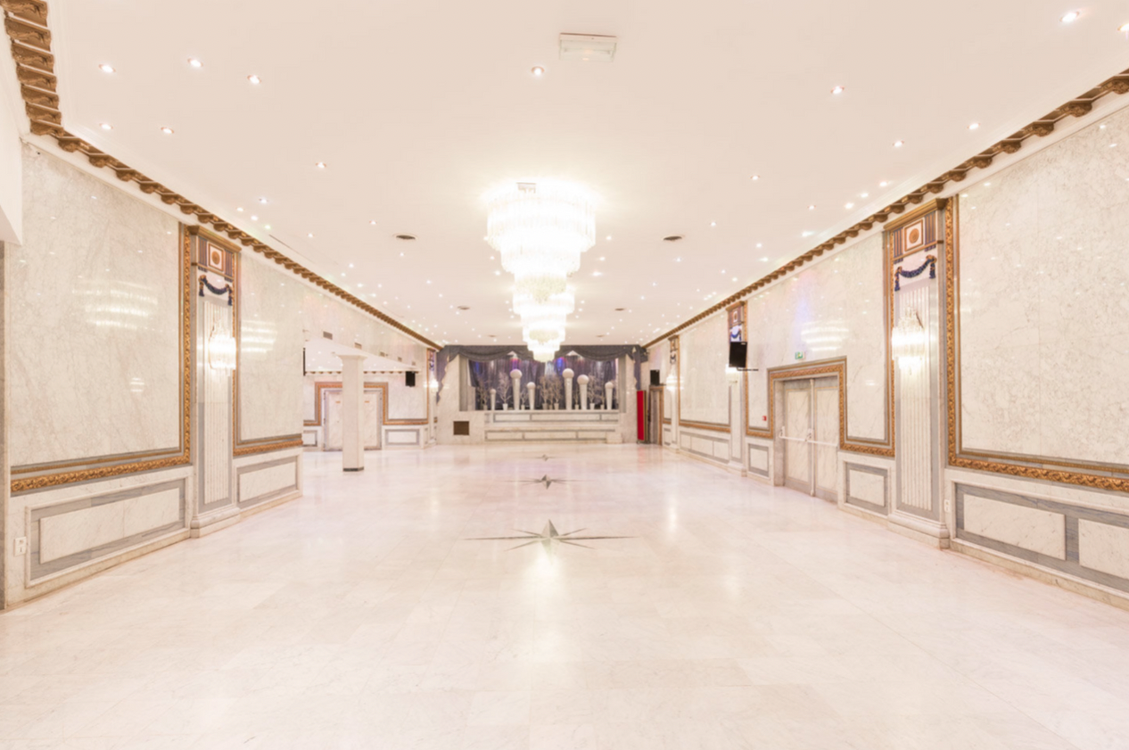 Elegant event venue with marble floors, perfect for banquets and conferences.