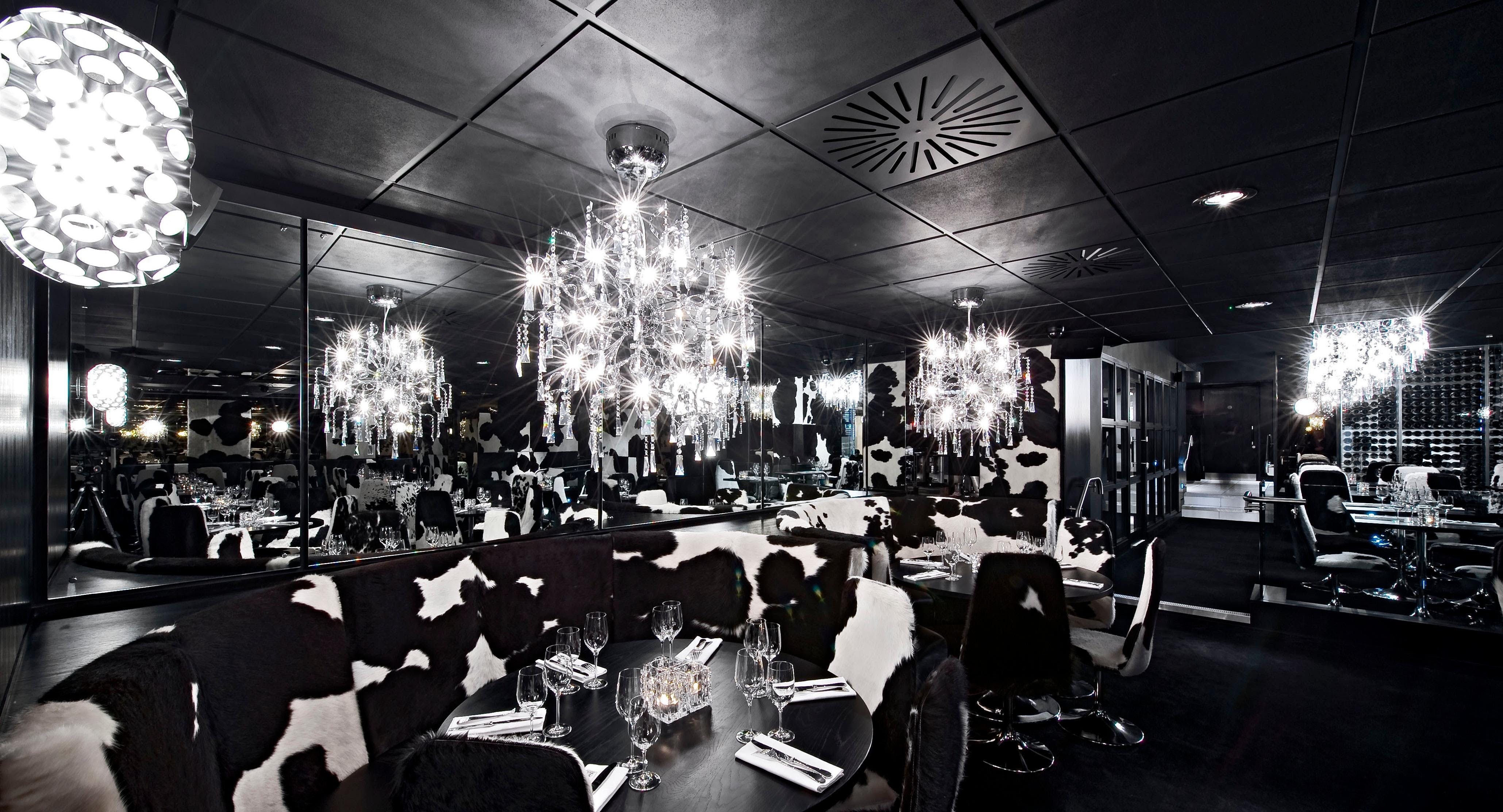 Stylish dining venue in Leeds with cow-print decor, perfect for events and themed dinners.