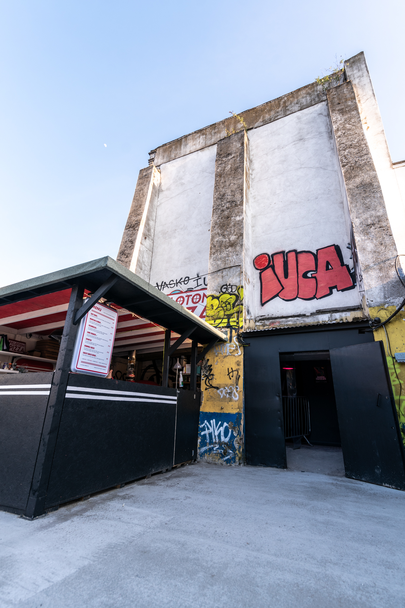 Vibrant urban venue with graffiti, perfect for creative events and casual gatherings.