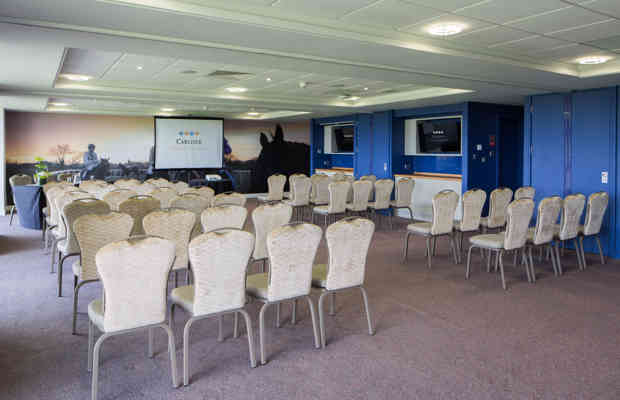 Carlisle Racecourse meeting space with arranged chairs for corporate events and training.